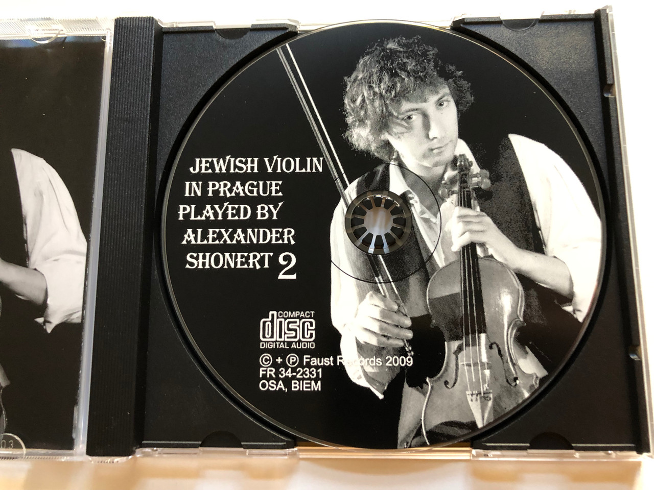 https://cdn10.bigcommerce.com/s-62bdpkt7pb/products/0/images/261641/Jewish_Violin_In_Prague_2_-_Played_By_Alexander_Shonert_Faust_Records_Audio_CD_2009_FR_34-2331_3__54236.1671649219.1280.1280.JPG?c=2&_gl=1*12i0vsf*_ga*MjA2NTIxMjE2MC4xNTkwNTEyNTMy*_ga_WS2VZYPC6G*MTY3MTY0NzQ4MC42ODEuMS4xNjcxNjQ5MTkwLjYwLjAuMA..