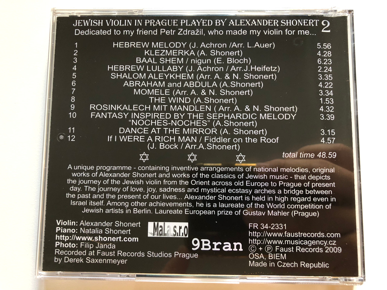 https://cdn10.bigcommerce.com/s-62bdpkt7pb/products/0/images/261644/Jewish_Violin_In_Prague_2_-_Played_By_Alexander_Shonert_Faust_Records_Audio_CD_2009_FR_34-2331_5__94270.1671649291.1280.1280.JPG?c=2&_gl=1*12i0vsf*_ga*MjA2NTIxMjE2MC4xNTkwNTEyNTMy*_ga_WS2VZYPC6G*MTY3MTY0NzQ4MC42ODEuMS4xNjcxNjQ5MTkwLjYwLjAuMA..
