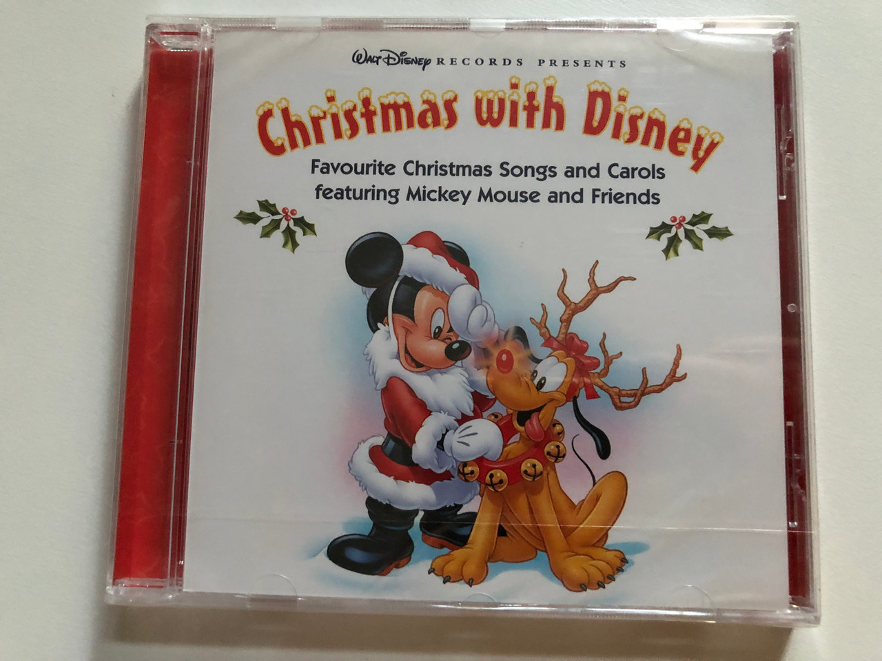 https://cdn10.bigcommerce.com/s-62bdpkt7pb/products/0/images/261845/Christmas_With_Disney_Walt_Disney_Records_Presents_-_Favourite_Christmas_Songs_and_Carols_featuring_Mickey_Mouse_and_Friends_Walt_Disney_Records_Audio_CD_2006_094637121528_1__48834.1671737755.1280.1280.JPG?c=2&_gl=1*1cldsnm*_ga*MjA2NTIxMjE2MC4xNTkwNTEyNTMy*_ga_WS2VZYPC6G*MTY3MTczNzIwMi42ODQuMS4xNjcxNzM3NzU5LjYwLjAuMA..