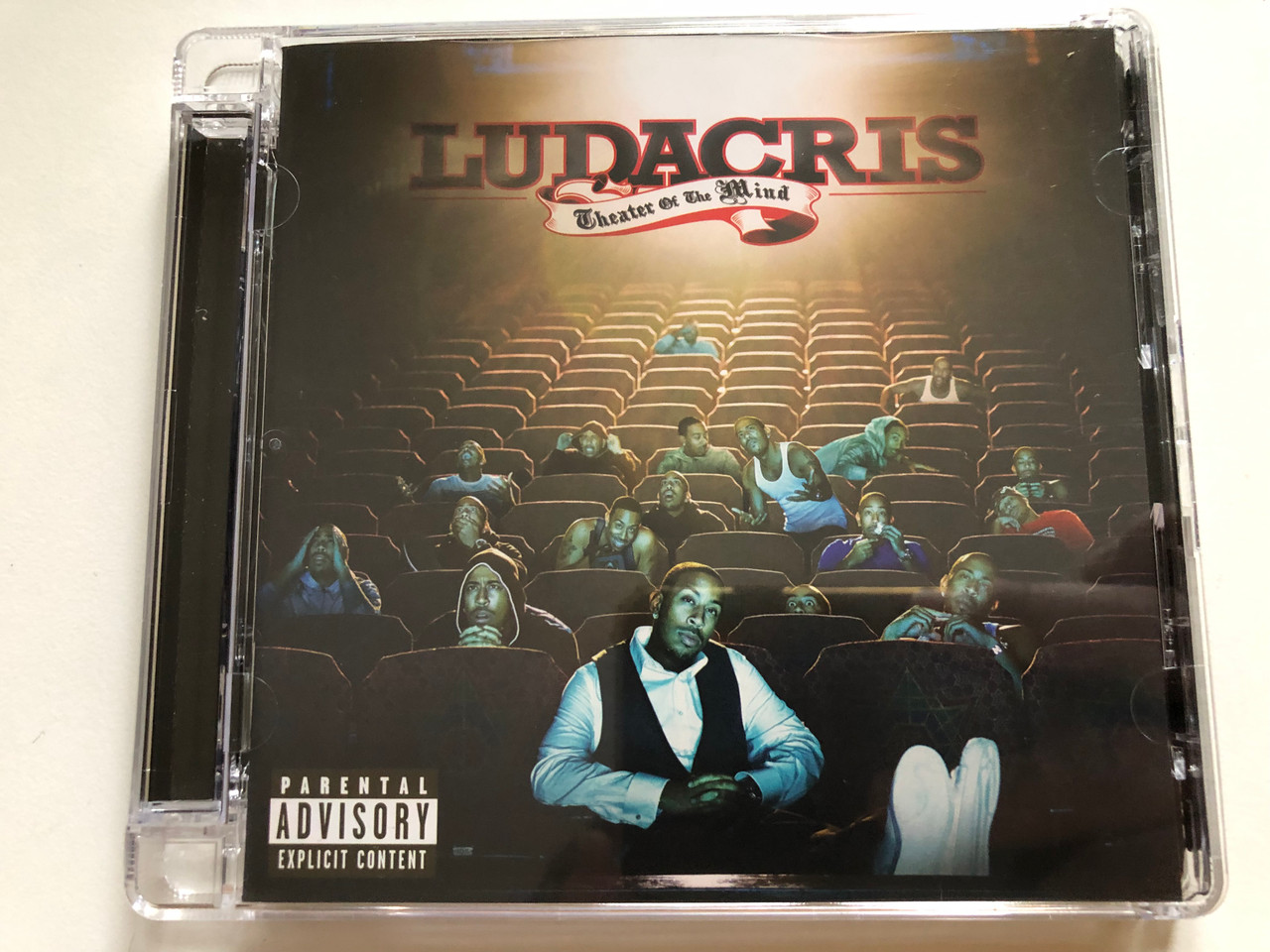 https://cdn10.bigcommerce.com/s-62bdpkt7pb/products/0/images/262019/Ludacris_Theater_Of_The_Mind_Disturbing_Tha_Peace_Audio_CD_2008_602517827523_1__69908.1672035323.1280.1280.JPG?c=2&_gl=1*fvijgw*_ga*MjA2NTIxMjE2MC4xNTkwNTEyNTMy*_ga_WS2VZYPC6G*MTY3MjAzNTE3OC42ODYuMC4xNjcyMDM1MTc4LjYwLjAuMA..