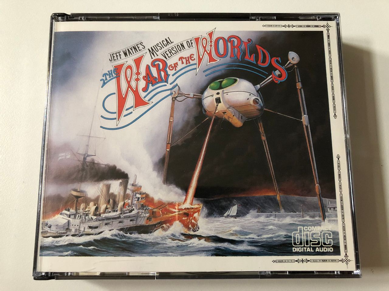 https://cdn10.bigcommerce.com/s-62bdpkt7pb/products/0/images/262529/Jeff_Waynes_Musical_Version_Of_The_War_Of_The_Worlds_CBS_2x_Audio_CD_CDCBS_96000_1__35643.1672306784.1280.1280.JPG?c=2&_gl=1*66zanw*_ga*MjA2NTIxMjE2MC4xNTkwNTEyNTMy*_ga_WS2VZYPC6G*MTY3MjMwNDc3MC42OTIuMS4xNjcyMzA2NjE1LjIyLjAuMA..