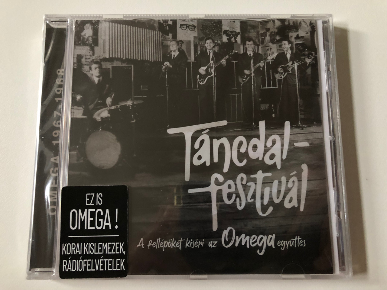 https://cdn10.bigcommerce.com/s-62bdpkt7pb/products/0/images/262541/Tancdal_festival_-_A_fellepoket_Kiseri_az_Omega_egyuttes_GrundRecords_Audio_CD_2022_GO02_1__63593.1672309391.1280.1280.JPG?c=2&_gl=1*1lbytne*_ga*MjA2NTIxMjE2MC4xNTkwNTEyNTMy*_ga_WS2VZYPC6G*MTY3MjMwNDc3MC42OTIuMS4xNjcyMzA4OTUyLjQ3LjAuMA..