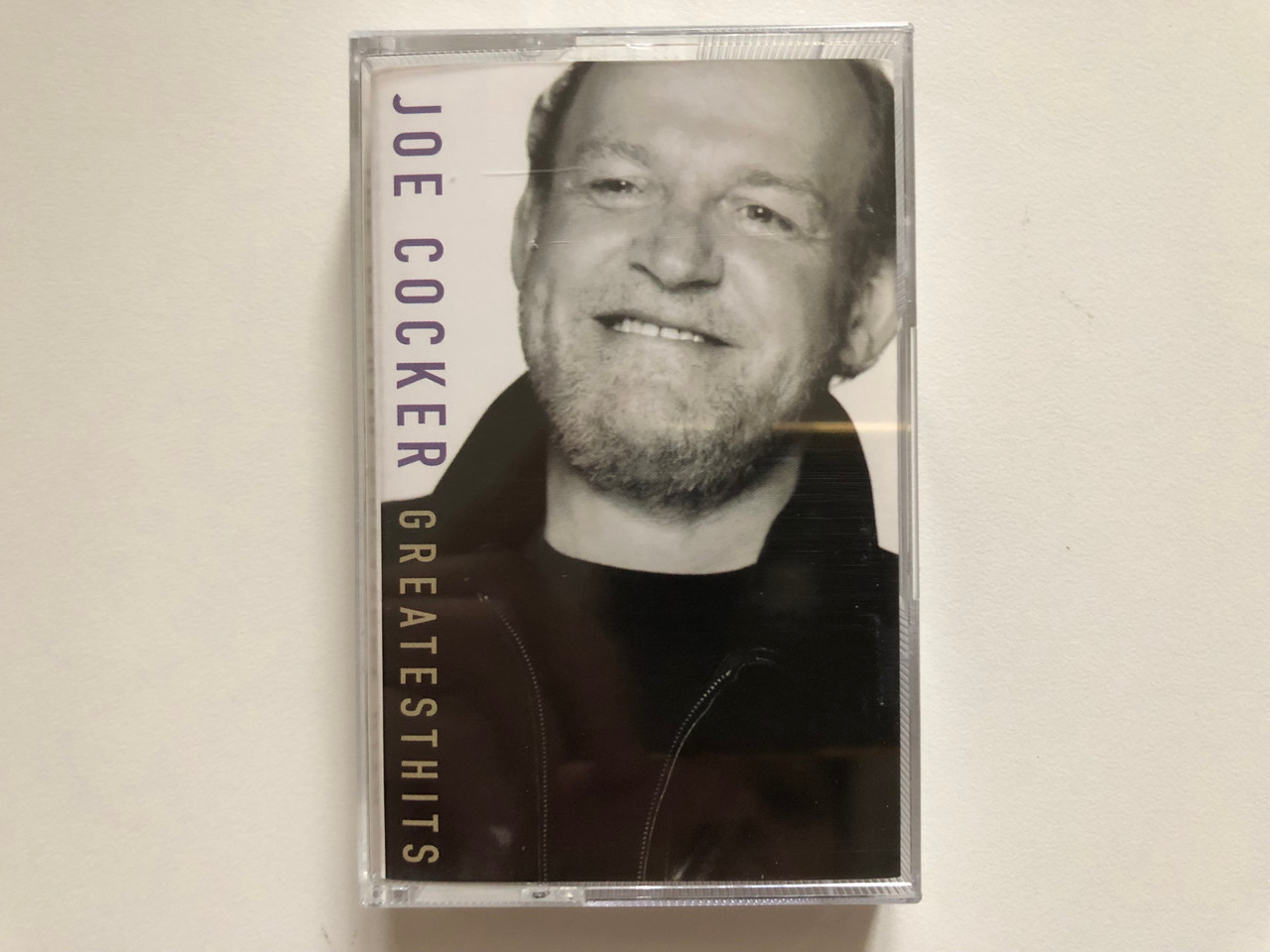 https://cdn10.bigcommerce.com/s-62bdpkt7pb/products/0/images/262698/Joe_Cocker_Greatest_Hits_EMI_Audio_Cassette_1998_724349771949_1__49113.1672379193.1280.1280.JPG?c=2&_gl=1*1urm6ih*_ga*MjA2NTIxMjE2MC4xNTkwNTEyNTMy*_ga_WS2VZYPC6G*MTY3MjM3NjIxMS42OTMuMS4xNjcyMzc5MTA1LjQwLjAuMA..