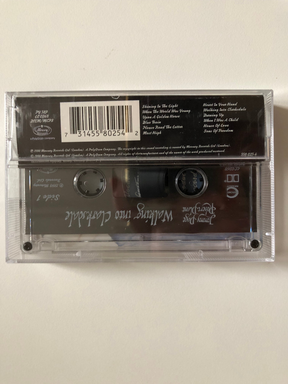https://cdn10.bigcommerce.com/s-62bdpkt7pb/products/0/images/262734/Jimmy_Page_Robert_Plant_Walking_Into_Clarksdale_Mercury_Audio_Cassette_1998_558_025-4_2__26742.1672387290.1280.1280.JPG?c=2&_gl=1*1ydtqnp*_ga*MjA2NTIxMjE2MC4xNTkwNTEyNTMy*_ga_WS2VZYPC6G*MTY3MjM3NjIxMS42OTMuMS4xNjcyMzg3Mjg3LjYwLjAuMA..