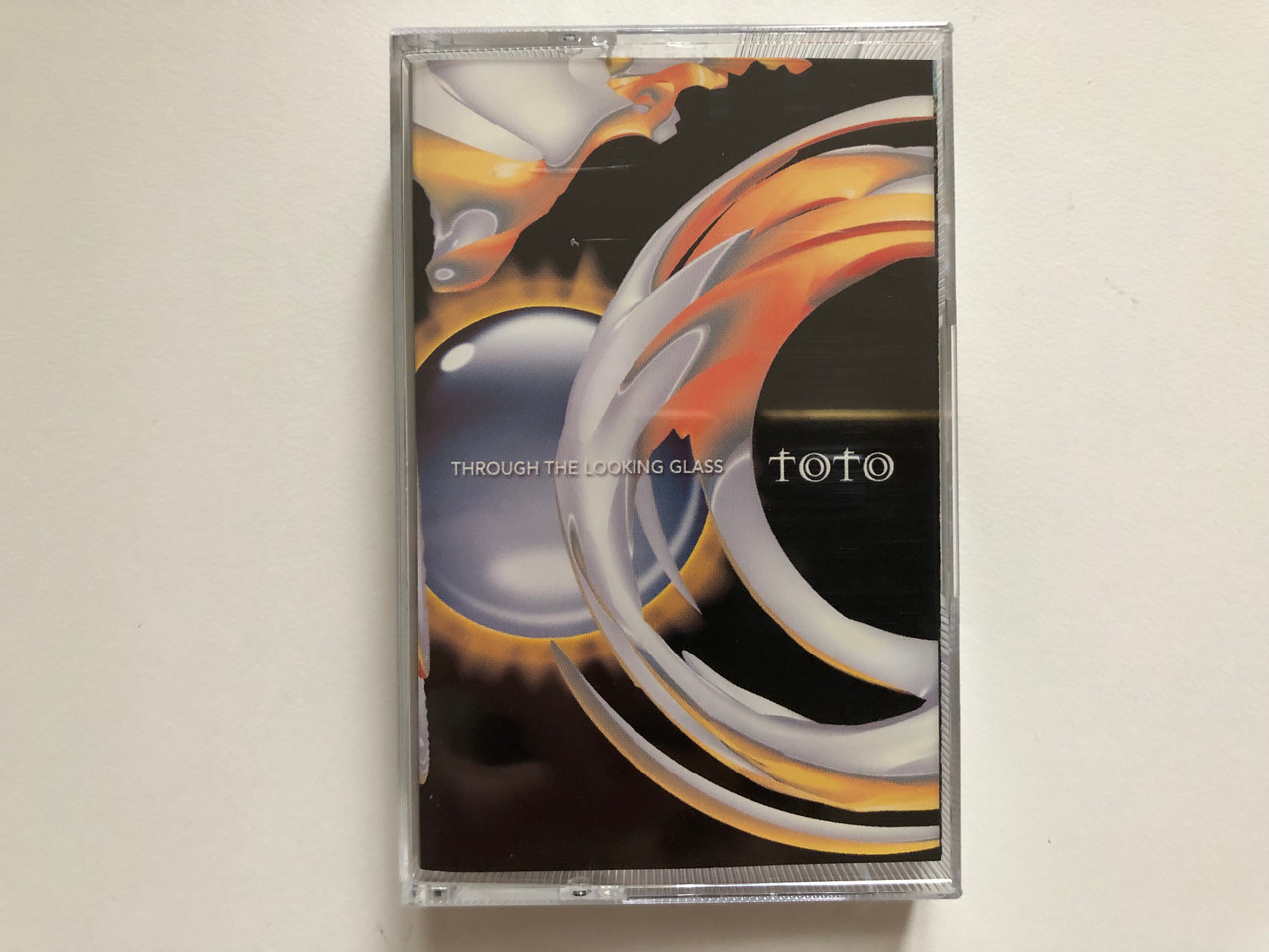 https://cdn10.bigcommerce.com/s-62bdpkt7pb/products/0/images/262750/Toto_Through_The_Looking_Glass_CMC_Audio_Cassette_5421444_1__27491.1672388660.1280.1280.JPG?c=2&_gl=1*13wrav4*_ga*MjA2NTIxMjE2MC4xNTkwNTEyNTMy*_ga_WS2VZYPC6G*MTY3MjM3NjIxMS42OTMuMS4xNjcyMzg4NjQ1LjYwLjAuMA..