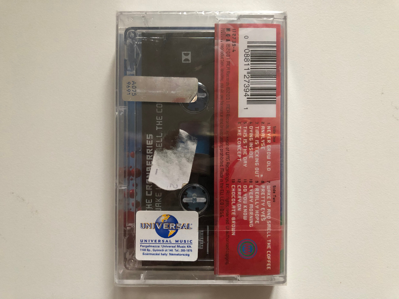 https://cdn10.bigcommerce.com/s-62bdpkt7pb/products/0/images/262831/The_Cranberries_Wake_Up_And_Smell_The_Coffee_MCA_Records_Audio_Cassette_2001_112_739-4_2__75515.1672649975.1280.1280.JPG?c=2&_gl=1*1fxd4mz*_ga*MjA2NTIxMjE2MC4xNTkwNTEyNTMy*_ga_WS2VZYPC6G*MTY3MjY0MTAyNS42OTQuMS4xNjcyNjQ5ODE2LjQyLjAuMA..