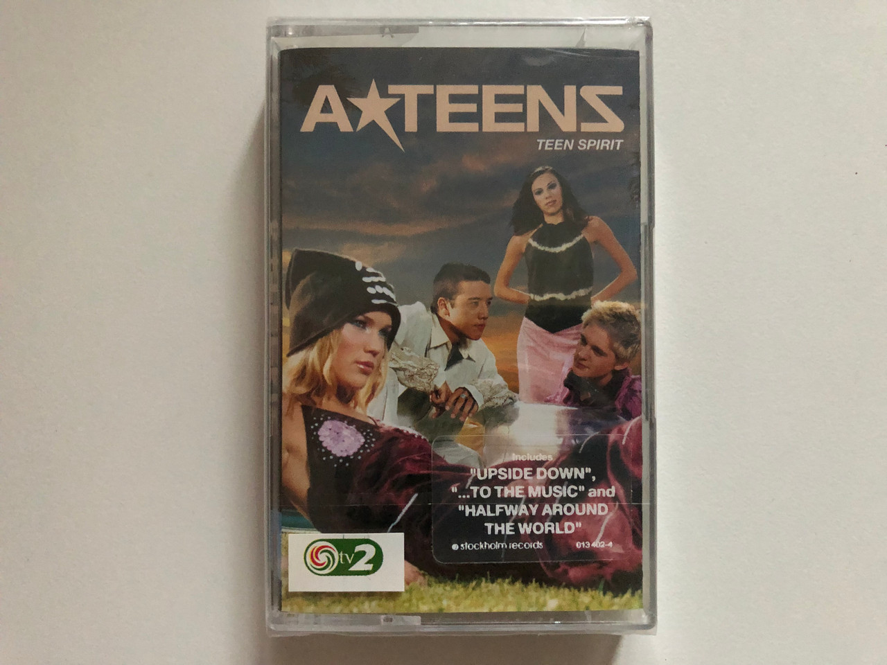 https://cdn10.bigcommerce.com/s-62bdpkt7pb/products/0/images/263019/ATeens_Teen_Spirit_Includes_Upside_Down_...To_The_Music_and_Halfway_Around_The_World_Magic_Records_Audio_Cassette_2001_013_402-4_1__64773.1672825600.1280.1280.JPG?c=2&_gl=1*151u0zr*_ga*MjA2NTIxMjE2MC4xNTkwNTEyNTMy*_ga_WS2VZYPC6G*MTY3MjgxNzIzMS42OTguMS4xNjcyODI1NTEwLjkuMC4w
