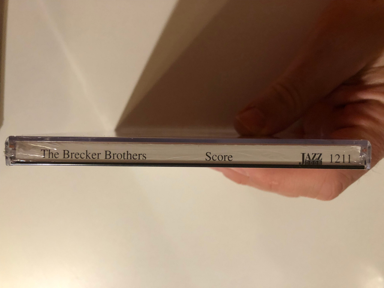 https://cdn10.bigcommerce.com/s-62bdpkt7pb/products/0/images/264302/The_Brecker_Bros._Score_Jazz_Door_Audio_CD_1991_1211_3__54977.1674031099.1280.1280.JPG?c=2&_gl=1*1mkbnal*_ga*MjA2NTIxMjE2MC4xNTkwNTEyNTMy*_ga_WS2VZYPC6G*MTY3NDAzMDkzMi43MTguMS4xNjc0MDMxMDg0LjYwLjAuMA..