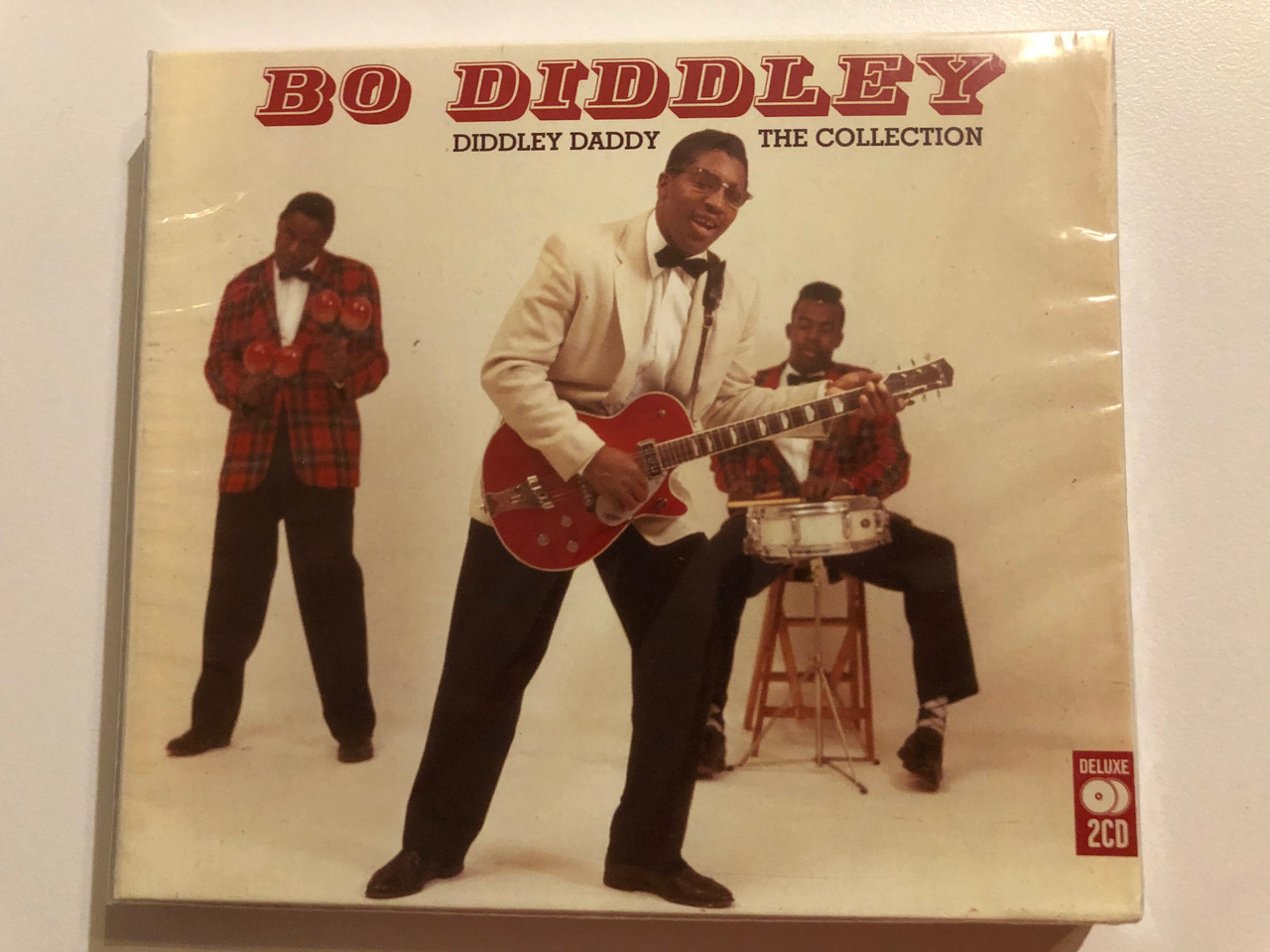 https://cdn10.bigcommerce.com/s-62bdpkt7pb/products/0/images/264373/Bo_Diddley_Diddley_Daddy_The_Collection_Music_Club_Deluxe_2x_Audio_CD_2012_MCDLX180_1__98072.1674054536.1280.1280.JPG?c=2&_gl=1*1o3c0zj*_ga*MjA2NTIxMjE2MC4xNTkwNTEyNTMy*_ga_WS2VZYPC6G*MTY3NDA1MjU3MC43MjAuMS4xNjc0MDU0NTU3LjYwLjAuMA..