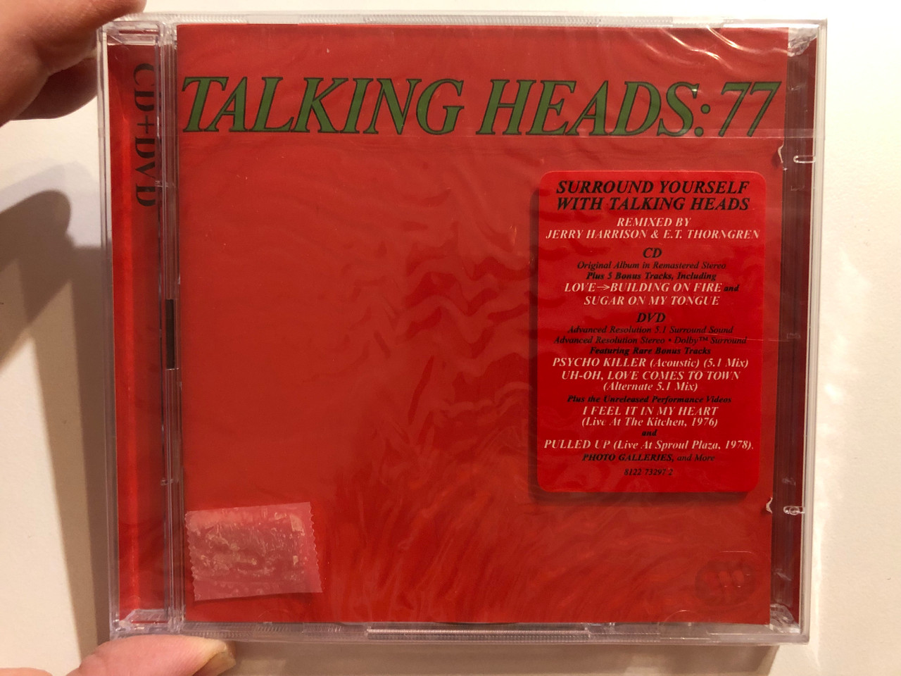 https://cdn10.bigcommerce.com/s-62bdpkt7pb/products/0/images/264442/Talking_Heads_77_Surround_Yourself_With_Talking_Heads_Remixed_By_Jerry_Harrison_E._T._Throngren_Sire_Audio_CD_DVD_Audio_CD_2006_8122_73297_2_1__80248.1674153147.1280.1280.JPG?c=2&_gl=1*1ud9lop*_ga*MjA2NTIxMjE2MC4xNTkwNTEyNTMy*_ga_WS2VZYPC6G*MTY3NDE0MTQxMy43MjEuMS4xNjc0MTUyOTIwLjU2LjAuMA..