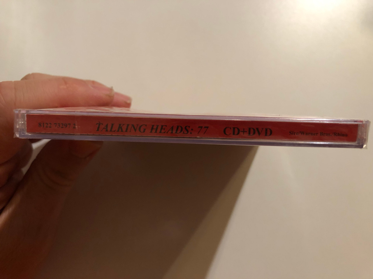 https://cdn10.bigcommerce.com/s-62bdpkt7pb/products/0/images/264444/Talking_Heads_77_Surround_Yourself_With_Talking_Heads_Remixed_By_Jerry_Harrison_E._T._Throngren_Sire_Audio_CD_DVD_Audio_CD_2006_8122_73297_2_3__83350.1674153164.1280.1280.JPG?c=2&_gl=1*116663i*_ga*MjA2NTIxMjE2MC4xNTkwNTEyNTMy*_ga_WS2VZYPC6G*MTY3NDE0MTQxMy43MjEuMS4xNjc0MTUyOTIwLjU2LjAuMA..