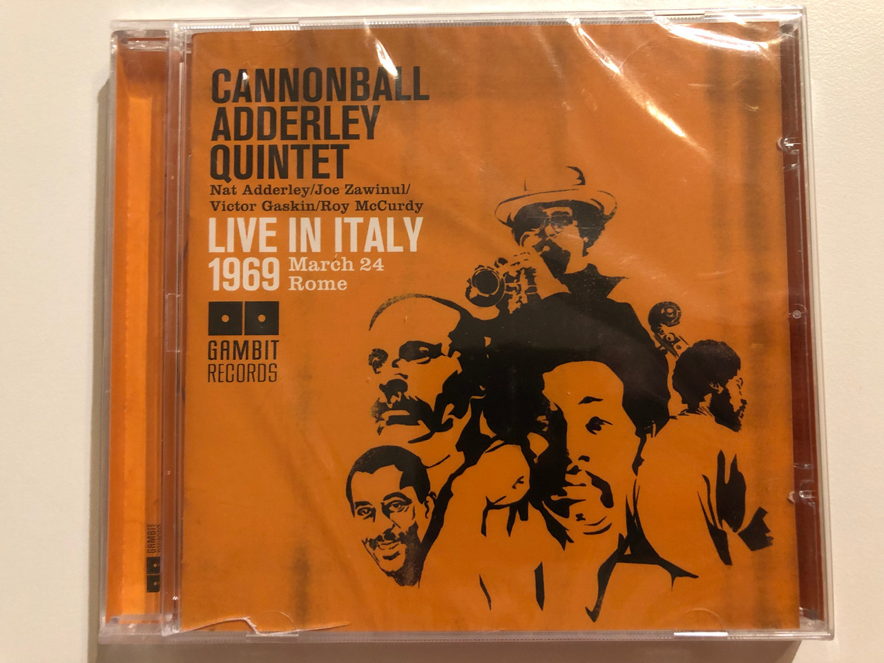 https://cdn10.bigcommerce.com/s-62bdpkt7pb/products/0/images/264472/Cannonball_Adderley_Quintet_Live_In_Italy_1969_March_24_Rome_Nat_Adderley_Joe_Zawinul_Victor_Gaskin_Roy_McCurdy_Gambit_Records_Audio_CD_2008_69289_1__18816.1674203017.1280.1280.JPG?c=2&_gl=1*1yvrg3q*_ga*MjA2NTIxMjE2MC4xNTkwNTEyNTMy*_ga_WS2VZYPC6G*MTY3NDIwMDIzMi43MjIuMS4xNjc0MjAyNjA5LjMwLjAuMA..
