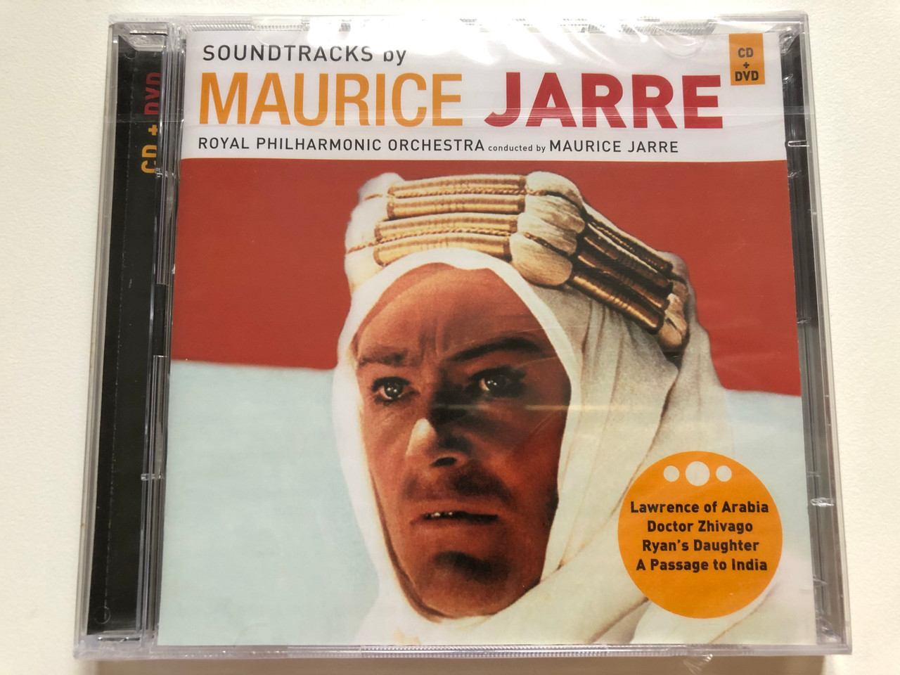 https://cdn10.bigcommerce.com/s-62bdpkt7pb/products/0/images/264742/Soundtracks_By_Maurice_Jarre_-_Royal_Philharmonic_Orchestra_Conducted_By_Maurice_Jarre_Lawrence_Of_Arabia_Doctor_Zhivago_Ryans_Daughter_A_Passage_To_India_Milan_Audio_CD_DVD_Video_CD_1__49164.1674625252.1280.1280.JPG?c=2&_gl=1*samcee*_ga*MjA2NTIxMjE2MC4xNTkwNTEyNTMy*_ga_WS2VZYPC6G*MTY3NDYyNDEyOC43MjkuMS4xNjc0NjI1MjUwLjYwLjAuMA..