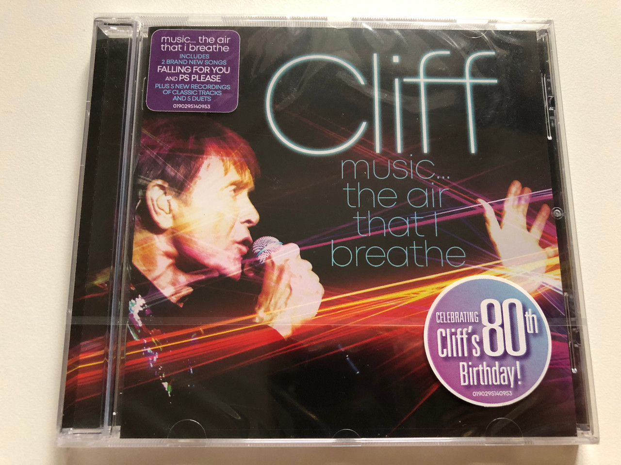 https://cdn10.bigcommerce.com/s-62bdpkt7pb/products/0/images/264800/Cliff_Music_._._._The_Air_That_I_Breathe_Celebrating_Cliffs_80th_Birthday_Music..._the_air_that_i_breathe_Includes_2_Brand_New_Songs_Falling_For_You_and_PS_Please_EastWest_Audio_CD_2_1__31529.1674639037.1280.1280.JPG?c=2&_gl=1*fn5qhd*_ga*MjA2NTIxMjE2MC4xNTkwNTEyNTMy*_ga_WS2VZYPC6G*MTY3NDYzMzI2OS43MzAuMS4xNjc0NjM5MDMxLjYwLjAuMA..