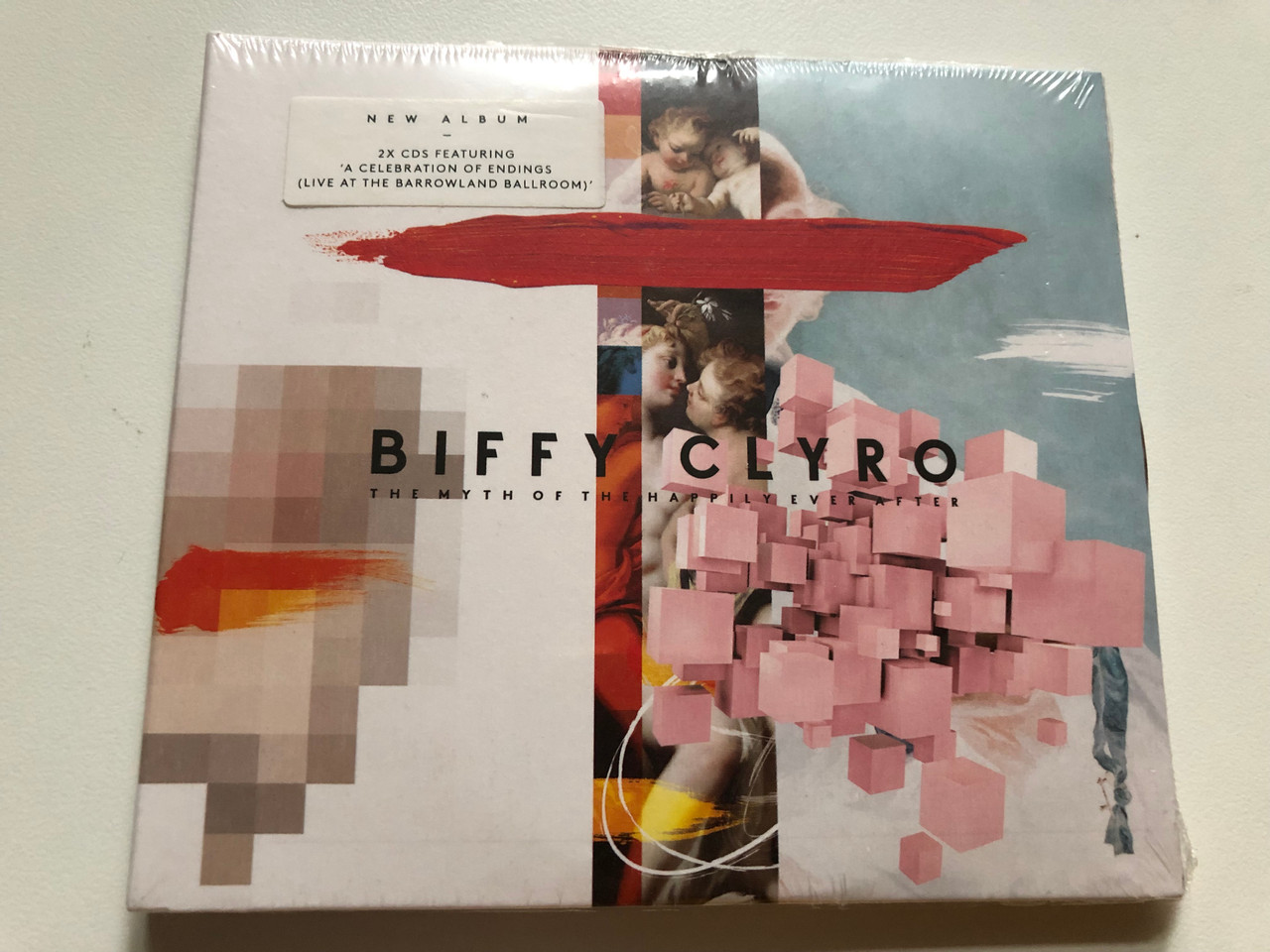 https://cdn10.bigcommerce.com/s-62bdpkt7pb/products/0/images/264803/Biffy_Clyro_The_Myth_Of_The_Happily_Ever_After_New_Album_2x_CDs_Featuring_A_Celebration_Of_Endings_Live_At_The_Barrowland_Ballroom_14th_Floor_Records_2x_Audio_CD_2021_0190296615054_1__76965.1674639659.1280.1280.JPG?c=2&_gl=1*1gjknd6*_ga*MjA2NTIxMjE2MC4xNTkwNTEyNTMy*_ga_WS2VZYPC6G*MTY3NDYzMzI2OS43MzAuMS4xNjc0NjM5MjU3LjM0LjAuMA..