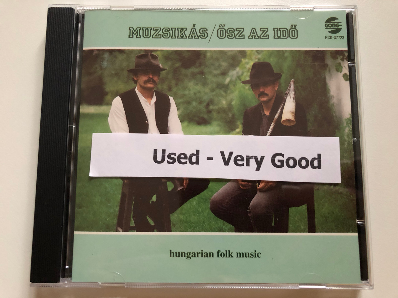 https://cdn10.bigcommerce.com/s-62bdpkt7pb/products/0/images/264948/Muzsiks_sz_Az_Id_Hungarian_Folk_Music_Gong_Audio_CD_1993_HCD-37723_8__15567.1674801107.1280.1280.JPG?c=2&_gl=1*l870uw*_ga*MjA2NTIxMjE2MC4xNTkwNTEyNTMy*_ga_WS2VZYPC6G*MTY3NDgwMDkyOC43MzMuMS4xNjc0ODAxMDkyLjYwLjAuMA..