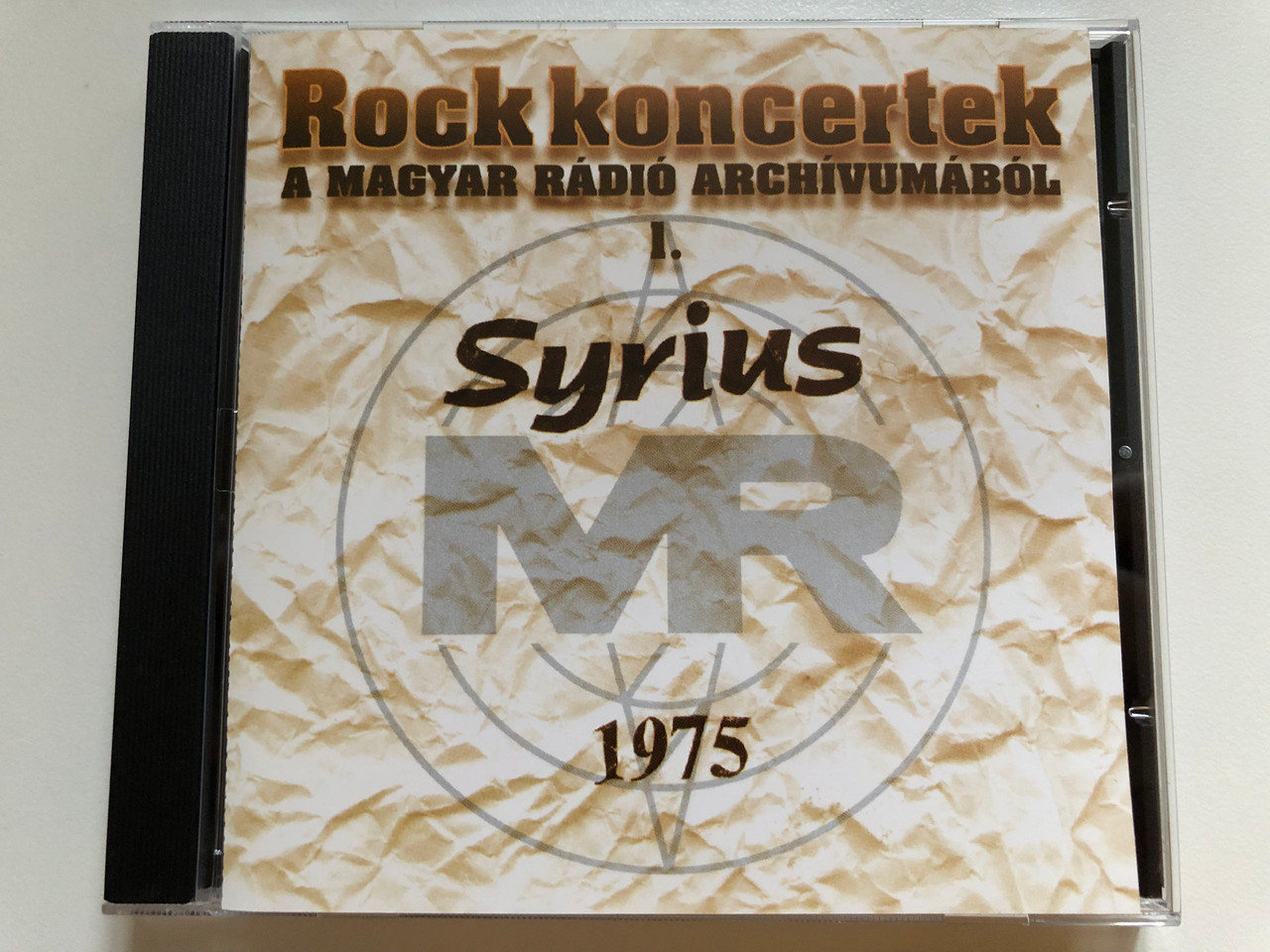 https://cdn10.bigcommerce.com/s-62bdpkt7pb/products/0/images/265124/Rock_koncertek_-_A_Magyar_Radio_Archivumabol_I._-_Syrius_1975_Premier_Art_Records_Audio_CD_1997_PAR97105_1__07915.1675066736.1280.1280.JPG?c=2&_gl=1*1sdvh9b*_ga*MjA2NTIxMjE2MC4xNTkwNTEyNTMy*_ga_WS2VZYPC6G*MTY3NTA2NDAxMC43MzQuMS4xNjc1MDY2NzQ0LjYwLjAuMA..