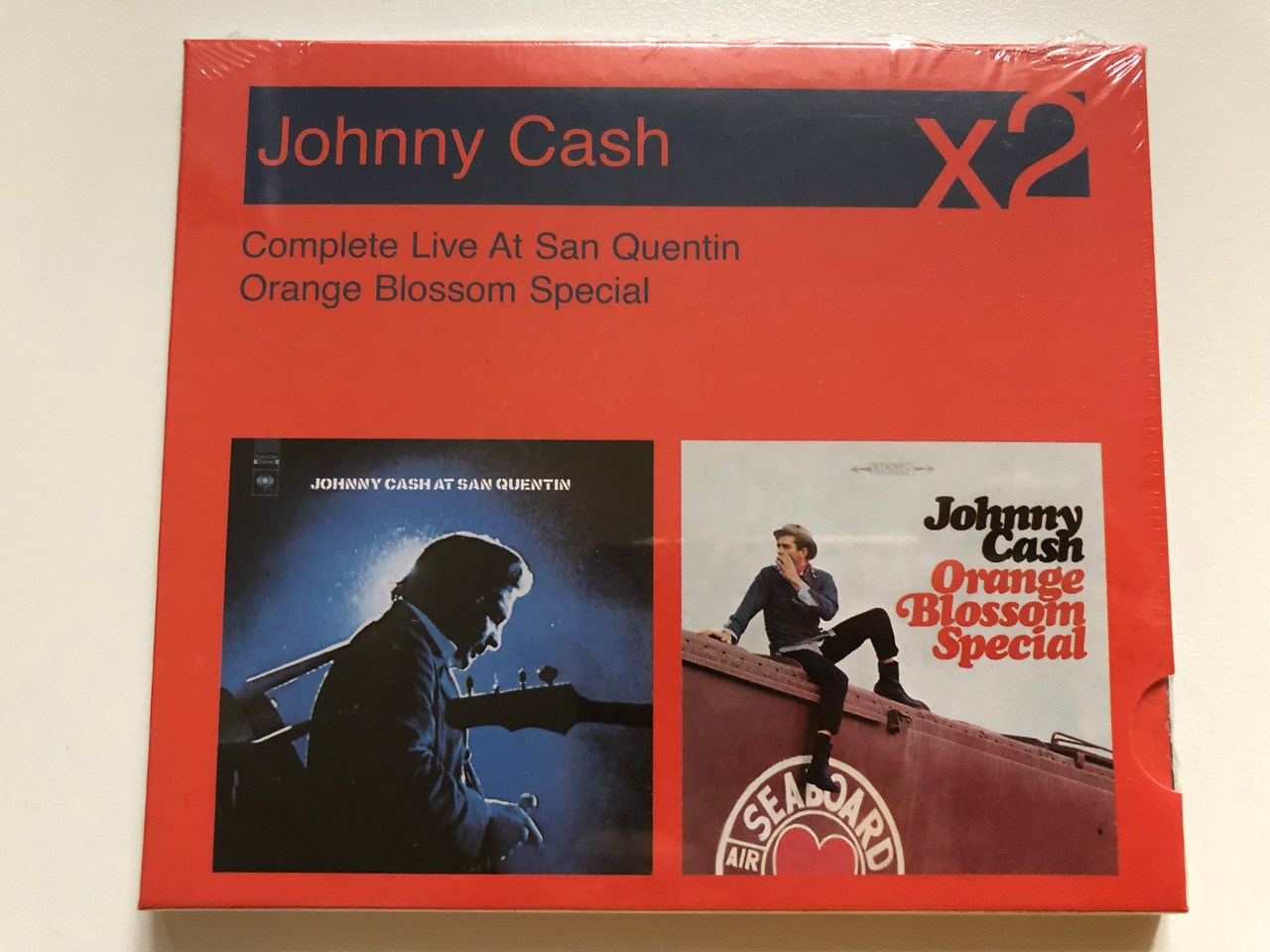 https://cdn10.bigcommerce.com/s-62bdpkt7pb/products/0/images/265244/Johnny_Cash_At_San_Quentin_Orange_Blossom_Special_-_Complete_Live_At_San_Quentin_Orange_Blossom_Special_Sony_BMG_Music_Entertainment_2x_Audio_CD_2008_Box_Set_88697282332_1__53848.1675157028.1280.1280.JPG?c=2&_gl=1*j6yk5b*_ga*MjA2NTIxMjE2MC4xNTkwNTEyNTMy*_ga_WS2VZYPC6G*MTY3NTE1NDAwNi43MzcuMS4xNjc1MTU3MDA0LjYwLjAuMA..