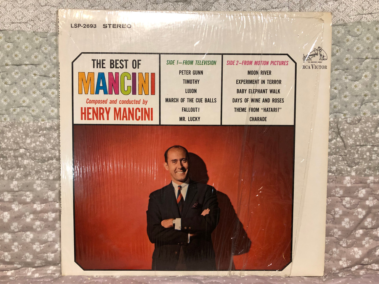 https://cdn10.bigcommerce.com/s-62bdpkt7pb/products/0/images/265700/The_Best_Of_Mancini_-_Composed_and_conducted_by_Henry_Mancini_Side_1_-_From_Television_Side_2_-_From_Motion_Pictures_RCA_Victor_LP_1964_Stereo_LSP-2693_1__99977.1675679899.1280.1280.JPG?c=2&_gl=1*tl2v5t*_ga*MjA2NTIxMjE2MC4xNTkwNTEyNTMy*_ga_WS2VZYPC6G*MTY3NTY2NTgzOS43NDUuMS4xNjc1Njc5Njc2LjE4LjAuMA..