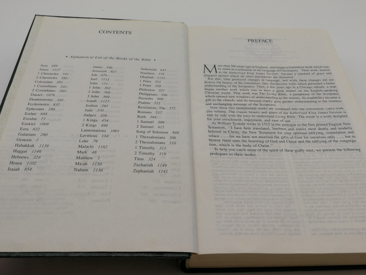 https://cdn10.bigcommerce.com/s-62bdpkt7pb/products/0/images/268261/Holy_Bible_Peoples_Parallel_Edition_-_King_James_Version_and_the_Living_Bible_Tyndale_House_Publishers_1985_Hardcover_Mid_Size_4__33966.1677687176.1280.1280.jpg?c=2&_gl=1*11vr4mp*_ga*MjA2NTIxMjE2MC4xNTkwNTEyNTMy*_ga_WS2VZYPC6G*MTY3NzY4MTgzOC43ODMuMS4xNjc3Njg3MTE3LjYwLjAuMA..