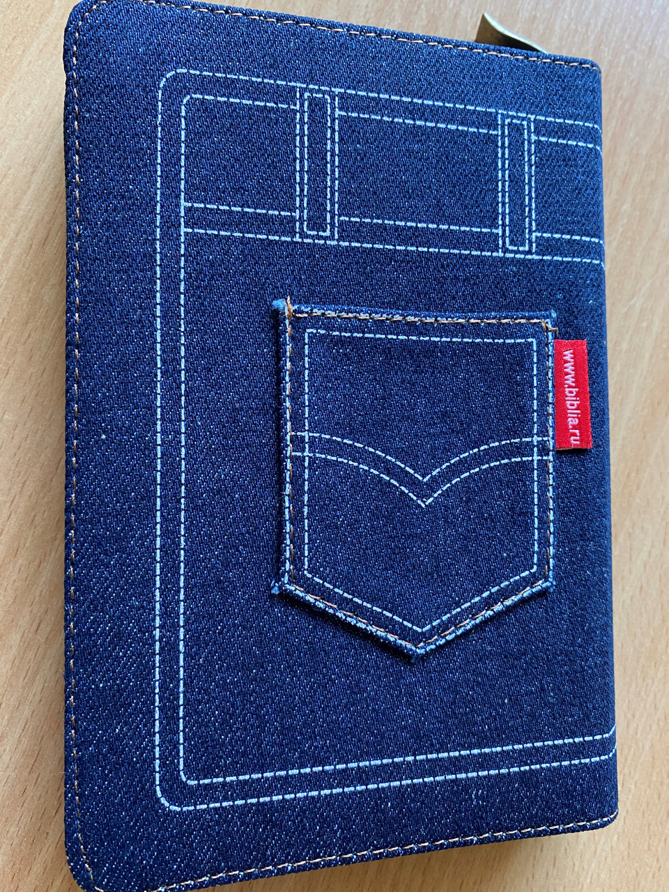 https://cdn10.bigcommerce.com/s-62bdpkt7pb/products/0/images/268750/Russian_Bible_-_Denim_binding_with_zipper_._2017_4__62037.1677855274.1280.1280.JPG?c=2&_gl=1*1983bg0*_ga*MjA2NTIxMjE2MC4xNTkwNTEyNTMy*_ga_WS2VZYPC6G*MTY3Nzg0OTEzMi43ODkuMS4xNjc3ODU1MjYzLjYwLjAuMA..