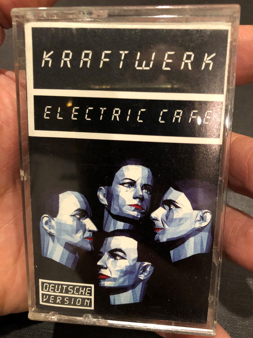https://cdn10.bigcommerce.com/s-62bdpkt7pb/products/0/images/269056/Kraftwerk_Electric_Cafe_Deutsche_Version_EMI_Audio_Cassette_264_240654_4_1__97898.1678164764.1280.1280.JPG?c=2&_gl=1*zajlta*_ga*MjA2NTIxMjE2MC4xNTkwNTEyNTMy*_ga_WS2VZYPC6G*MTY3ODE2NDQ5OC43OTMuMC4xNjc4MTY0NDk4LjYwLjAuMA..