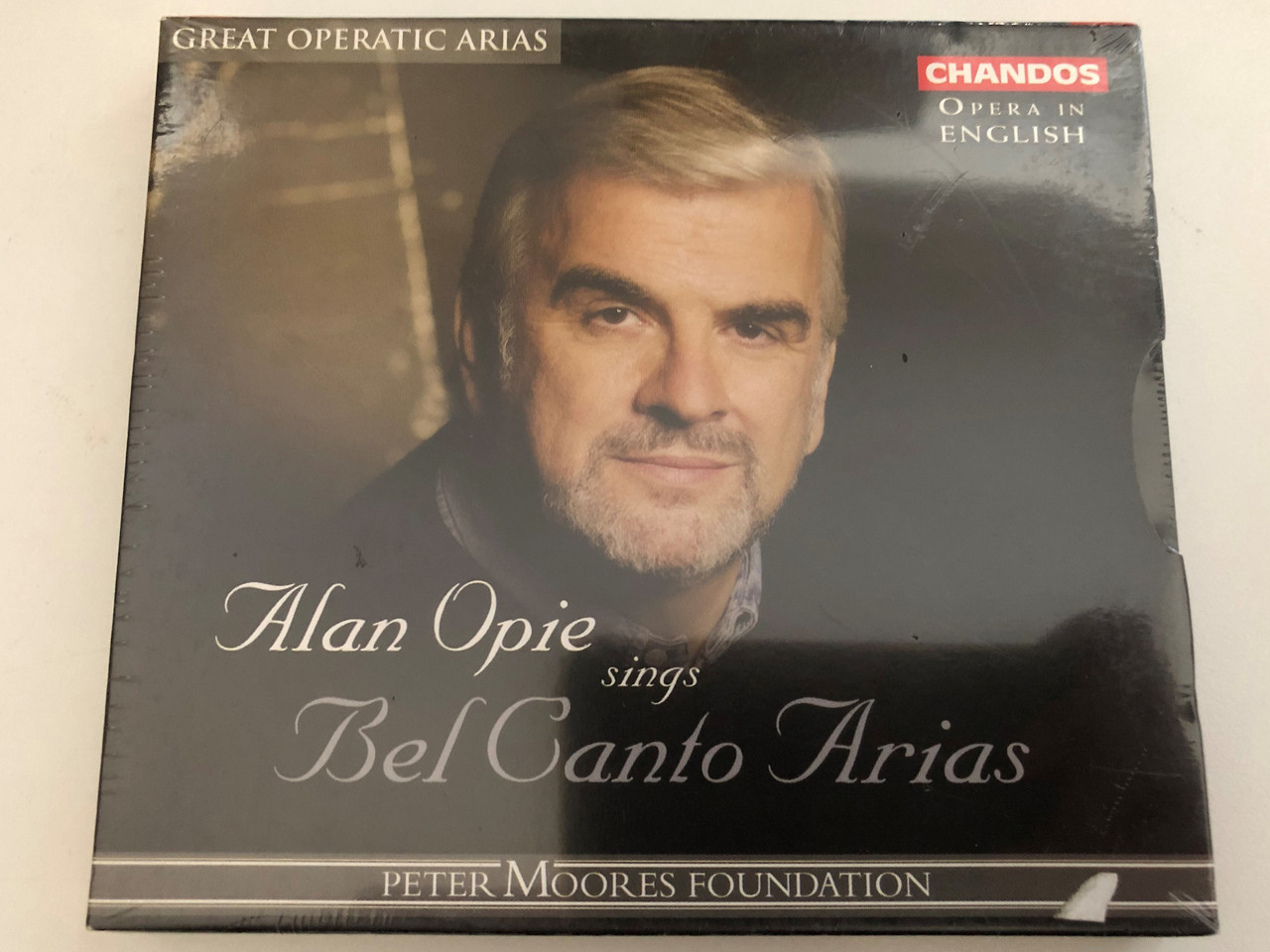 https://cdn10.bigcommerce.com/s-62bdpkt7pb/products/0/images/269116/Alan_Opie_Sings_Bel_Canto_Arias_Opera_In_English_Peter_Moores_Foundation_Great_Operatic_AriasOpera_In_English_Peter_Moores_Foundation_Great_Operatic_Arias_Chandos_Audio_CD_2003_CHAN_1__88024.1678175543.1280.1280.JPG?c=2&_gl=1*1xowult*_ga*MjA2NTIxMjE2MC4xNTkwNTEyNTMy*_ga_WS2VZYPC6G*MTY3ODE2OTMzNS43OTQuMS4xNjc4MTc1NTIyLjYwLjAuMA..