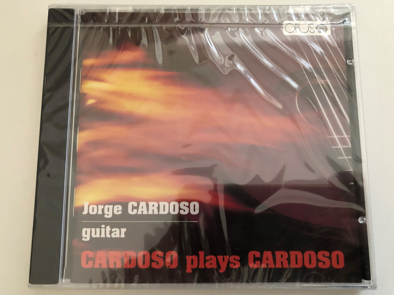 https://cdn10.bigcommerce.com/s-62bdpkt7pb/products/0/images/269138/Jorge_Cardoso_guitar_-_Cardoso_Plays_Cardoso_Opus_Audio_CD_1989_9351_2123_1__61015.1678260771.1280.1280.JPG?c=2&_gl=1*1lp6rld*_ga*MjA2NTIxMjE2MC4xNTkwNTEyNTMy*_ga_WS2VZYPC6G*MTY3ODI1ODY3Ny43OTYuMS4xNjc4MjYwNDI4LjkuMC4w