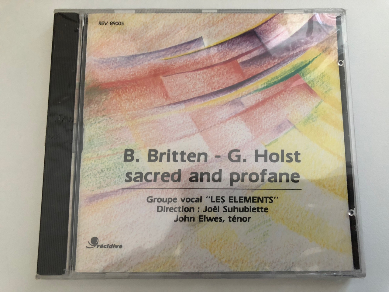 https://cdn10.bigcommerce.com/s-62bdpkt7pb/products/0/images/269248/B._Britten_G._Holst_Sacred_And_Profane_-_Groupe_Vocal_Les_lments_Direction_Jol_Suhubiette_John_Elwes_tnor_Rcidive_Audio_CD_1989_Rev_89005_1__58047.1678357416.1280.1280.JPG?c=2&_gl=1*1u8dgkj*_ga*MjA2NTIxMjE2MC4xNTkwNTEyNTMy*_ga_WS2VZYPC6G*MTY3ODM0NjI5NS43OTguMS4xNjc4MzU2NzAxLjQ0LjAuMA..