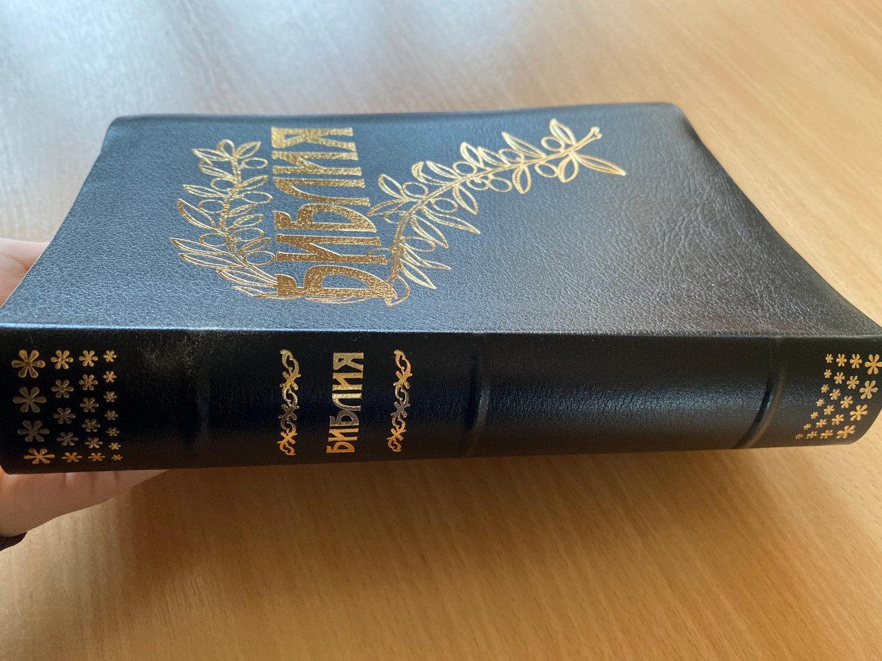 https://cdn10.bigcommerce.com/s-62bdpkt7pb/products/0/images/269422/Russian_Bible_-_Black_-_Black_Leather_bound_with_golden_cut_and_golden_edges_Ukrainian_Bible_Society_2019_FT1075601_2__13925.1678726396.1280.1280.JPG?c=2&_gl=1*1wdhl6d*_ga*MjA2NTIxMjE2MC4xNTkwNTEyNTMy*_ga_WS2VZYPC6G*MTY3ODcxMDQ2NC44MDEuMS4xNjc4NzI2Mzg1LjYwLjAuMA..