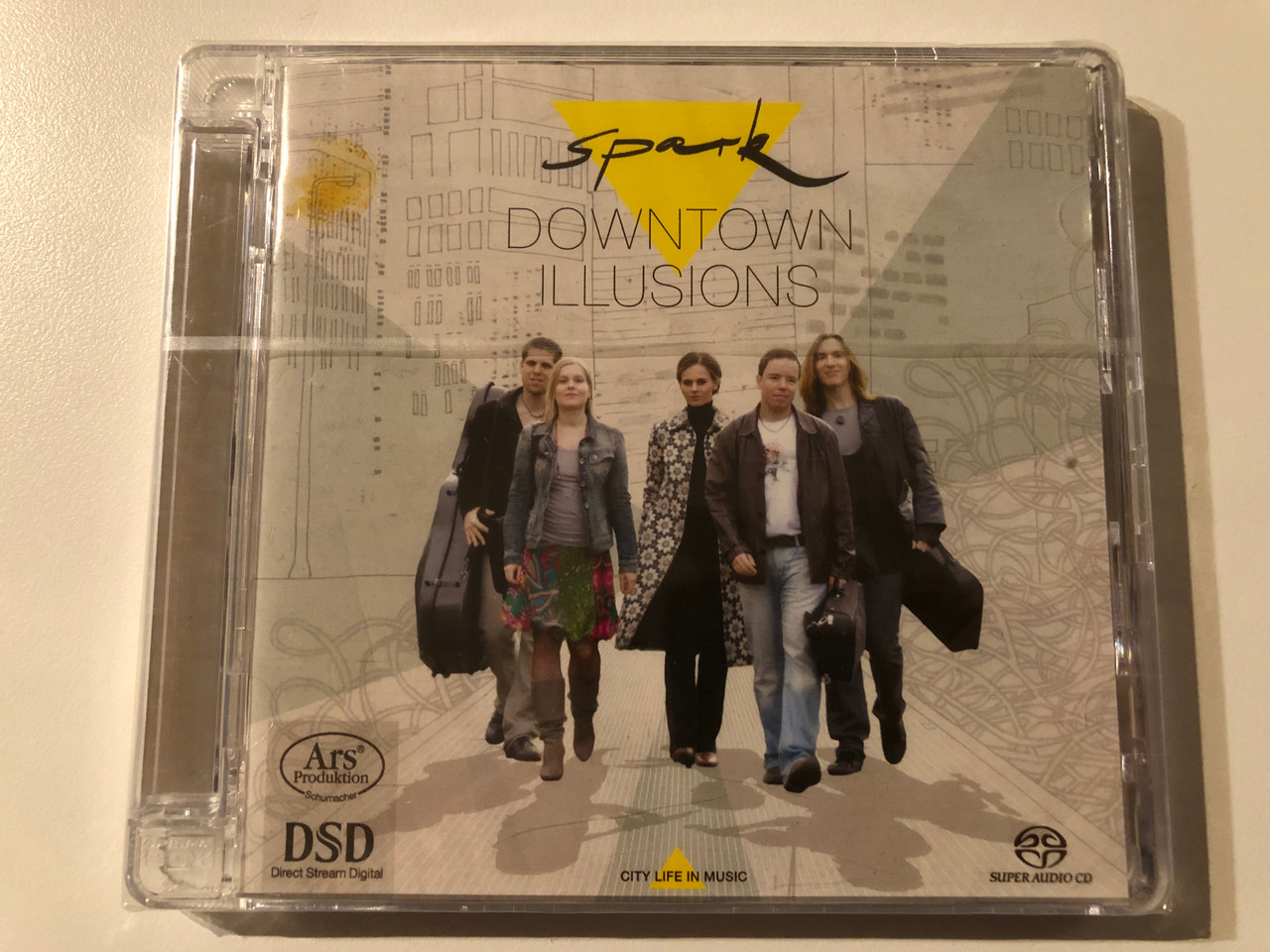 https://cdn10.bigcommerce.com/s-62bdpkt7pb/products/0/images/269525/Spark_Downtown_Illusions_City_Life_In_Music_Ars_Produktion_Hybrid_Disc_2010_ARS_38_084_1__27037.1678820213.1280.1280.JPG?c=2&_gl=1*yqwrl7*_ga*MjA2NTIxMjE2MC4xNTkwNTEyNTMy*_ga_WS2VZYPC6G*MTY3ODgwNjMzMy44MDMuMS4xNjc4ODIwMDY2LjM0LjAuMA..
