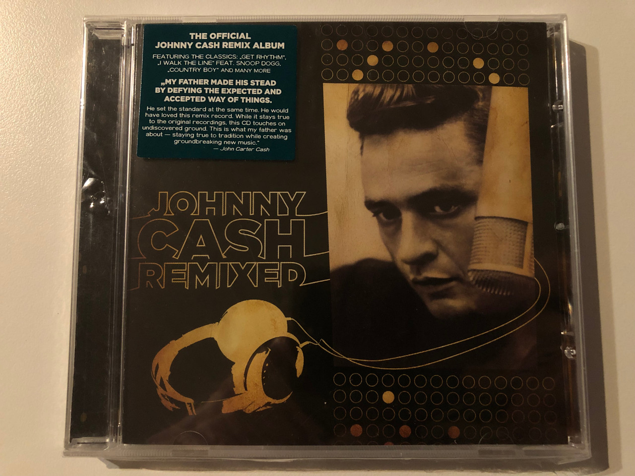 https://cdn10.bigcommerce.com/s-62bdpkt7pb/products/0/images/269561/Johnny_Cash_Remixed_The_Official_Johnny_Cash_Remix_Album_Featuring_The_Classics_Get_Rhythm._I_Walk_The_Line_Feat._Snoop_Dogg_Country_Boy_and_many_more_Ear_Music_Audio_CD_2009_1__35814.1678888376.1280.1280.JPG?c=2&_gl=1*12m8z3l*_ga*MjA2NTIxMjE2MC4xNTkwNTEyNTMy*_ga_WS2VZYPC6G*MTY3ODg4ODA1NC44MDUuMS4xNjc4ODg4Mzk1LjYwLjAuMA..