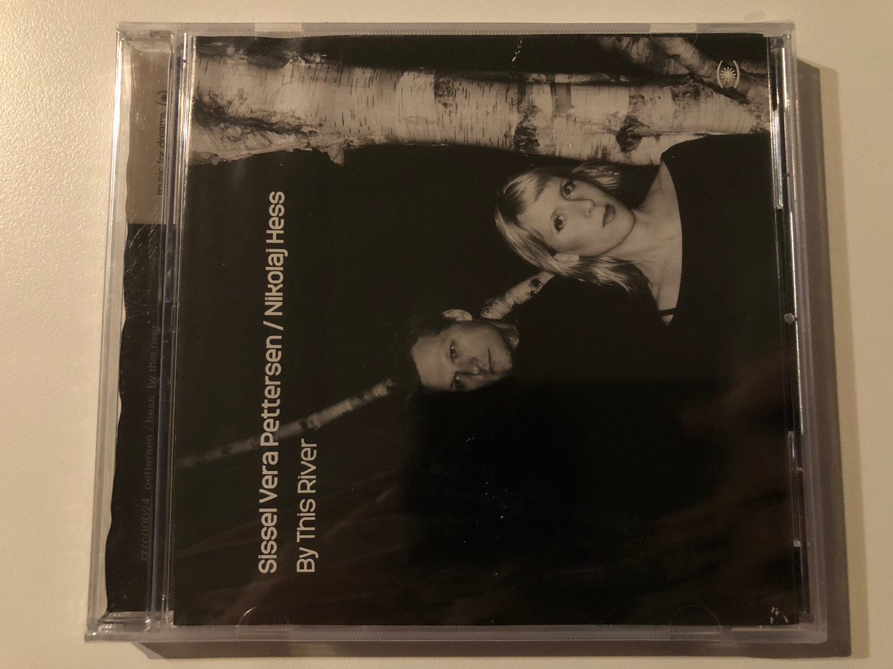 https://cdn10.bigcommerce.com/s-62bdpkt7pb/products/0/images/269565/Sissel_Vera_Pettersen_Nikolaj_Hess_By_This_River_Music_For_Dreams_Audio_CD_2006_zzzcd0024_1__92069.1678889067.1280.1280.JPG?c=2&_gl=1*1wrp465*_ga*MjA2NTIxMjE2MC4xNTkwNTEyNTMy*_ga_WS2VZYPC6G*MTY3ODg4ODA1NC44MDUuMS4xNjc4ODg4OTY2LjM3LjAuMA..