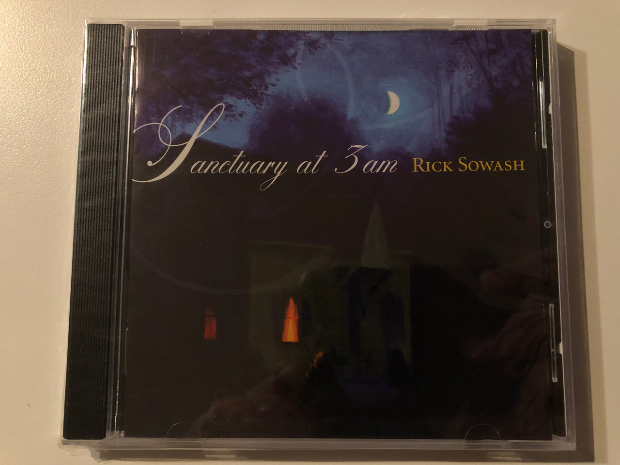 https://cdn10.bigcommerce.com/s-62bdpkt7pb/products/0/images/269586/Rick_Sowash_Sanctuary_At_3_AM_Rick_Sowash_Publishing_Co._Audio_CD_2004_1__61085.1678902378.1280.1280.JPG?c=2&_gl=1*1fu9rmz*_ga*MjA2NTIxMjE2MC4xNTkwNTEyNTMy*_ga_WS2VZYPC6G*MTY3ODkwMDQ1NC44MDYuMS4xNjc4OTAyNDM1LjYwLjAuMA..
