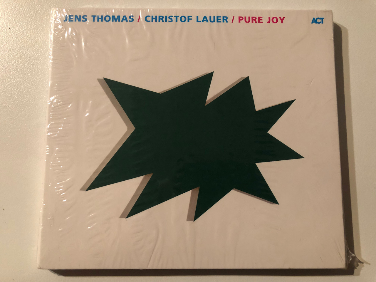 https://cdn10.bigcommerce.com/s-62bdpkt7pb/products/0/images/269610/Jens_Thomas_Christof_Lauer_Pure_Joy_ACT_Audio_CD_2003_ACT_9415-2_1__76832.1678907061.1280.1280.JPG?c=2&_gl=1*6tppq6*_ga*MjA2NTIxMjE2MC4xNTkwNTEyNTMy*_ga_WS2VZYPC6G*MTY3ODkwMDQ1NC44MDYuMS4xNjc4OTA3MDU4LjYwLjAuMA..