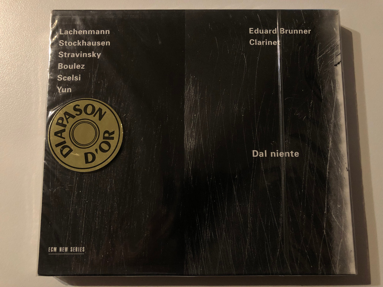 https://cdn10.bigcommerce.com/s-62bdpkt7pb/products/0/images/269641/Lachenmann_Stockhausen_Stravinsky_Boulez_Scelsi_Yun_-_Eduard_Brunner_clarinet_-_Dal_Niente_ECM_Records_Audio_CD_1997_ECM_1599_1__33597.1678976405.1280.1280.JPG?c=2&_gl=1*13h4foo*_ga*MjA2NTIxMjE2MC4xNTkwNTEyNTMy*_ga_WS2VZYPC6G*MTY3ODk3NTA3Ni44MDguMS4xNjc4OTc2Mjc0LjU5LjAuMA..