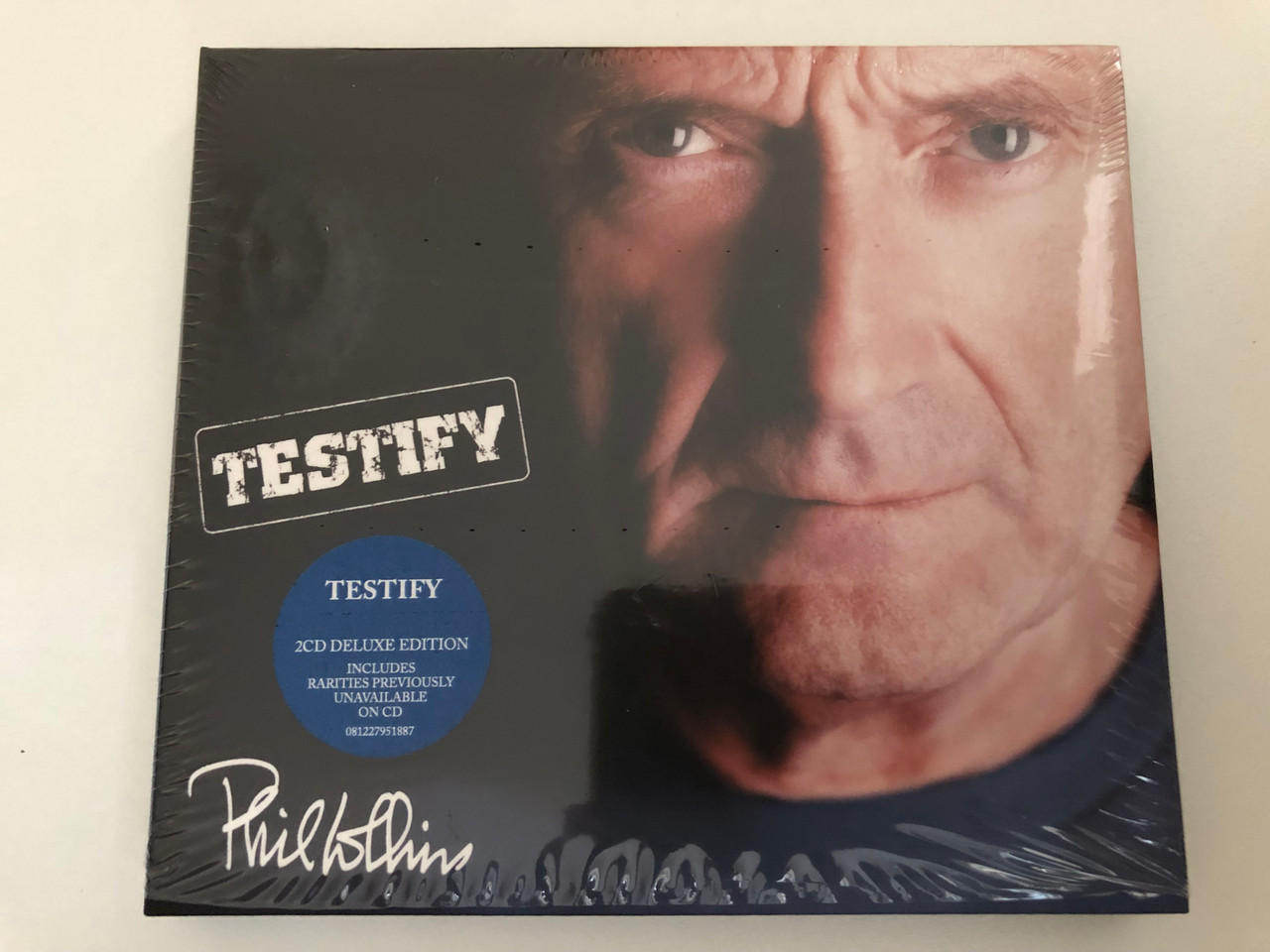 https://cdn10.bigcommerce.com/s-62bdpkt7pb/products/0/images/270278/Phil_Collins_Testify_2CD_Deluxe_Edition_Includes_Rarities_Previously_Unavailable_On_CD_Atlantic_2x_Audio_CD_2016_081227951887_1__20152.1679505116.1280.1280.JPG?c=2&_gl=1*1c4td9l*_ga*MjA2NTIxMjE2MC4xNTkwNTEyNTMy*_ga_WS2VZYPC6G*MTY3OTUwMzg3OS44MTcuMS4xNjc5NTA0OTU5LjQzLjAuMA..