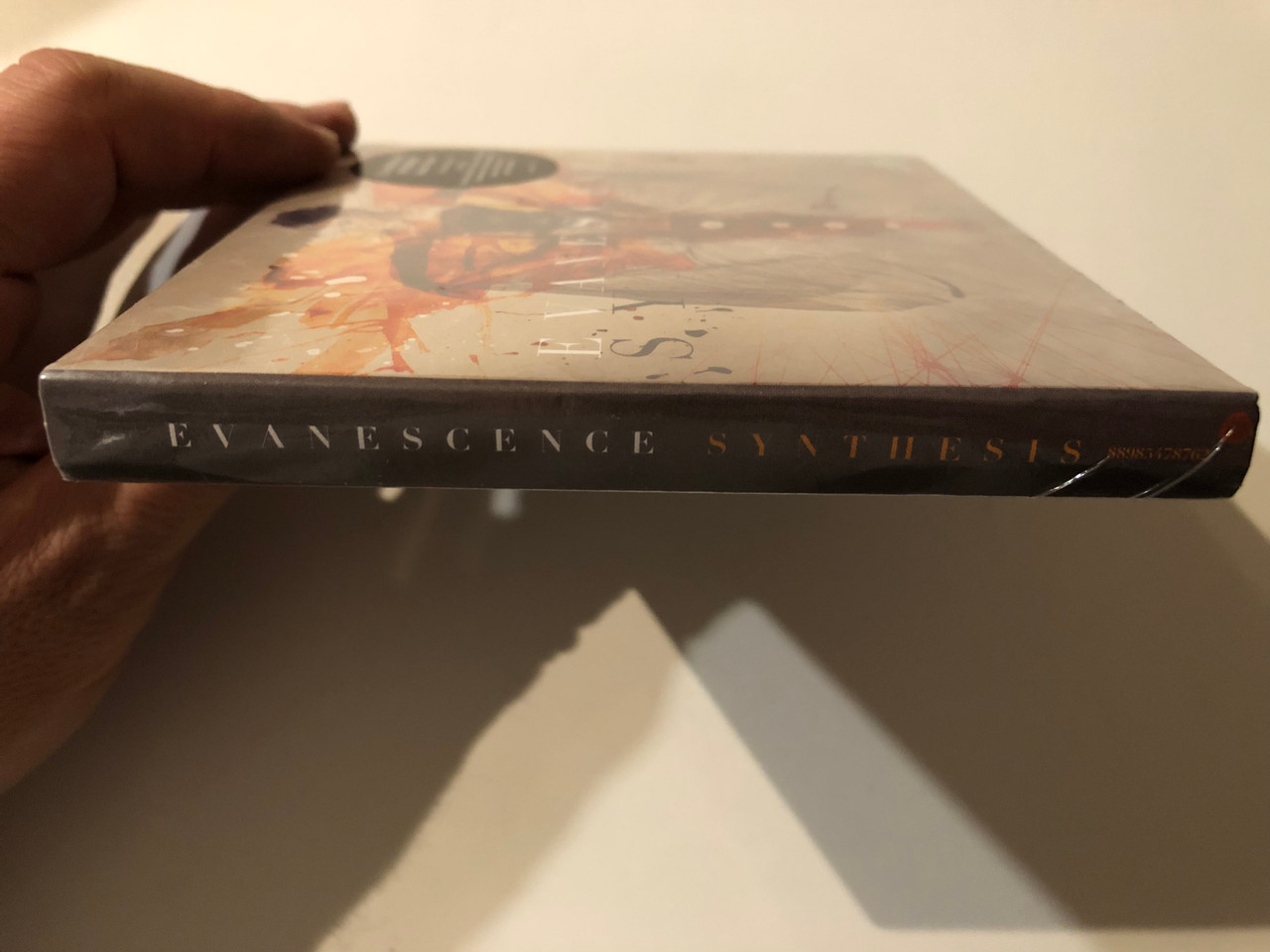 https://cdn10.bigcommerce.com/s-62bdpkt7pb/products/0/images/270287/Evanescence_Synthesis_Deluxe_Version_CD_with_16_tracks_DVD_with_From_The_Inside_The_Creation_Of_Synthesis_Documentary_Instrumental_album_piano_orchestra_score_and_5.1_album_mix_3__58836.1679506199.1280.1280.JPG?c=2&_gl=1*cggumn*_ga*MjA2NTIxMjE2MC4xNTkwNTEyNTMy*_ga_WS2VZYPC6G*MTY3OTUwMzg3OS44MTcuMS4xNjc5NTA1OTcxLjQ0LjAuMA..