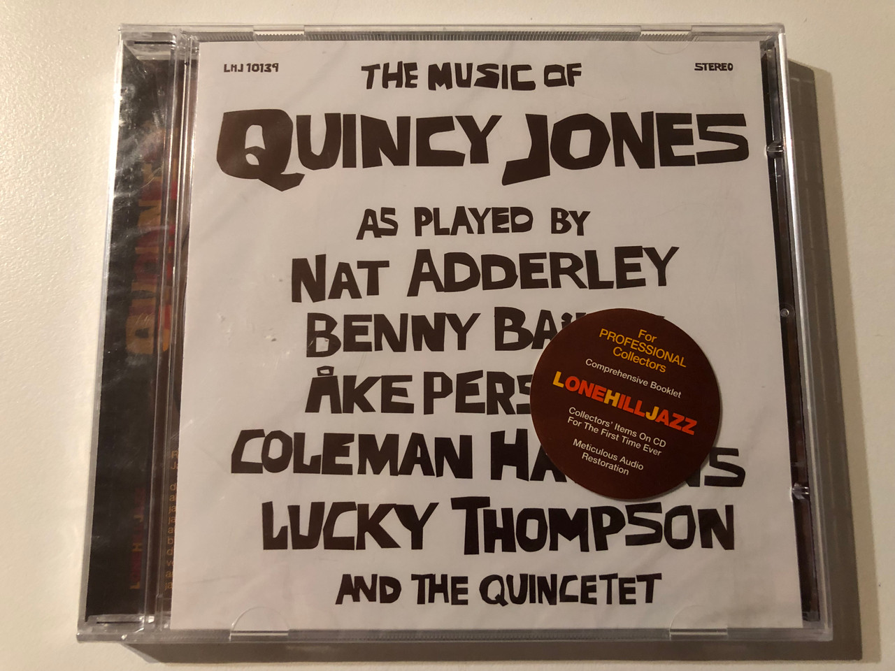 https://cdn10.bigcommerce.com/s-62bdpkt7pb/products/0/images/270472/The_Music_Of_Quincy_Jones_-_As_Played_By_Nat_Adderley_Benny_Bailey_Ake_Persson_Coleman_Hawkins_Lucky_Thompson_and_the_Quincetet_Lone_Hill_Jazz_Audio_CD_2004_LHJ_10139_1__19308.1679640700.1280.1280.JPG?c=2&_gl=1*cdgru5*_ga*MjA2NTIxMjE2MC4xNTkwNTEyNTMy*_ga_WS2VZYPC6G*MTY3OTYzODIwNi44MjAuMS4xNjc5NjQwNjUxLjYwLjAuMA..
