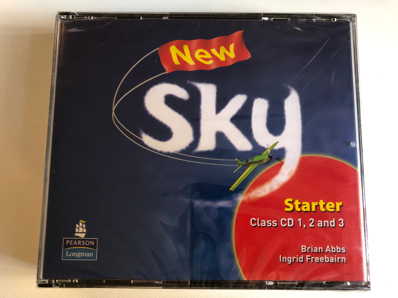 https://cdn10.bigcommerce.com/s-62bdpkt7pb/products/0/images/270824/New_Sky_Starter_-_Class_CD1_2_and_3_-_Brian_Abbs_Ingrid_Freebairn_Pearson_Longman_3x_Audio_CD_9781405874687_1__66858.1679938114.1280.1280.JPG?c=2&_gl=1*godyn6*_ga*MjA2NTIxMjE2MC4xNTkwNTEyNTMy*_ga_WS2VZYPC6G*MTY3OTkzNzAzOC44MjMuMS4xNjc5OTM4MTAwLjYwLjAuMA..