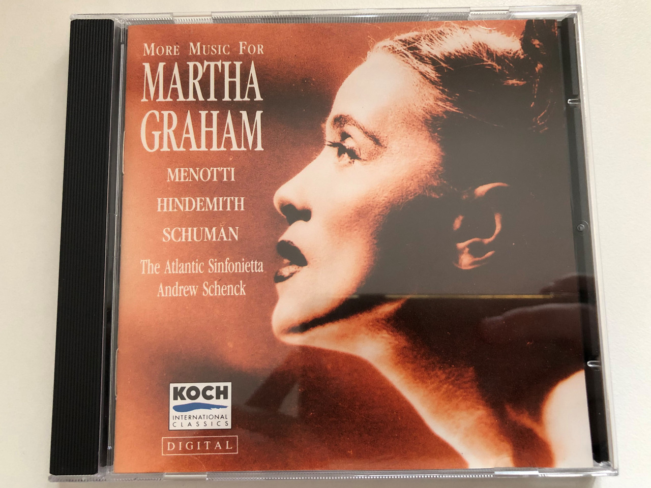 https://cdn10.bigcommerce.com/s-62bdpkt7pb/products/0/images/270981/More_Music_For_Martha_Graham_-_Menotti_Hindemith_Schuman_-_The_Atlantic_Sinfonietta_Andrew_Schenck_Koch_International_Classics_Audio_CD_1991_3-7051-2_H1_1__57222.1680013920.1280.1280.JPG?c=2&_gl=1*1ut5gky*_ga*MjA2NTIxMjE2MC4xNTkwNTEyNTMy*_ga_WS2VZYPC6G*MTY4MDAwODU4Mi44MjQuMS4xNjgwMDEzNzE2LjUxLjAuMA..