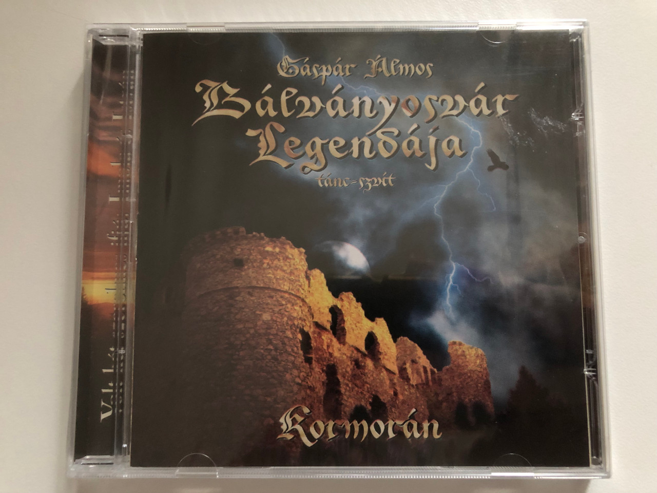 https://cdn10.bigcommerce.com/s-62bdpkt7pb/products/0/images/271316/Gspr_lmos_Blvnyosvr_Legendja_tanc-szuit_-_Kormorn_Periferic_Records_Audio_CD_2008_BGCD_193_1__52605.1680105773.1280.1280.JPG?c=2&_gl=1*ewwqtf*_ga*MjA2NTIxMjE2MC4xNTkwNTEyNTMy*_ga_WS2VZYPC6G*MTY4MDA5NDQwMi44MjUuMS4xNjgwMTA1MjY2LjM4LjAuMA..