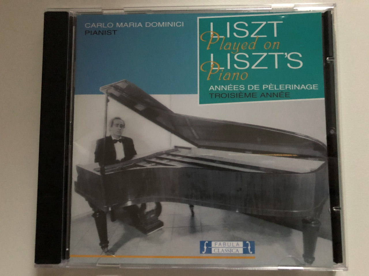 https://cdn10.bigcommerce.com/s-62bdpkt7pb/products/0/images/271865/Carlo_Maria_Dominici_pianist_-_Liszt_Played_On_Liszts_Piano_-_Annees_De_Pelerinage_Fabula_Classica_Audio_CD_2001_FAB_29901-2_1__33345.1680510203.1280.1280.JPG?c=2&_gl=1*s7qfte*_ga*MjA2NTIxMjE2MC4xNTkwNTEyNTMy*_ga_WS2VZYPC6G*MTY4MDUwMzk3Ni44MzAuMS4xNjgwNTEwMTkzLjYwLjAuMA..