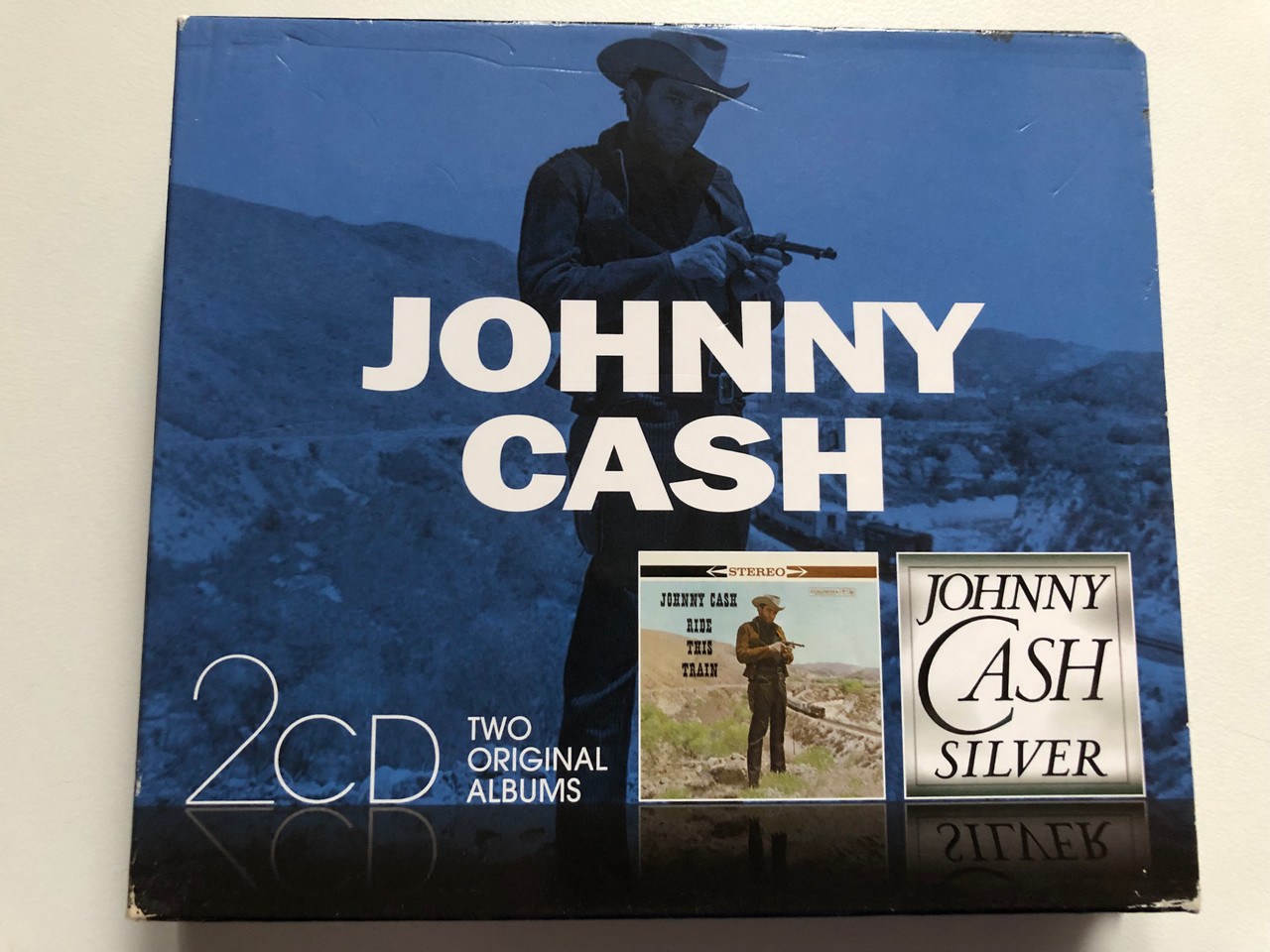 https://cdn10.bigcommerce.com/s-62bdpkt7pb/products/0/images/272283/Johnny_Cash_-_Ride_This_Train_Silver_Sony_Music_2x_Audio_CD_2013_88883737612_1__38623.1681142270.1280.1280.JPG?c=2&_gl=1*cobpky*_ga*MjA2NTIxMjE2MC4xNTkwNTEyNTMy*_ga_WS2VZYPC6G*MTY4MTEzMTk2MC44NDIuMS4xNjgxMTQyMDM3LjMwLjAuMA..