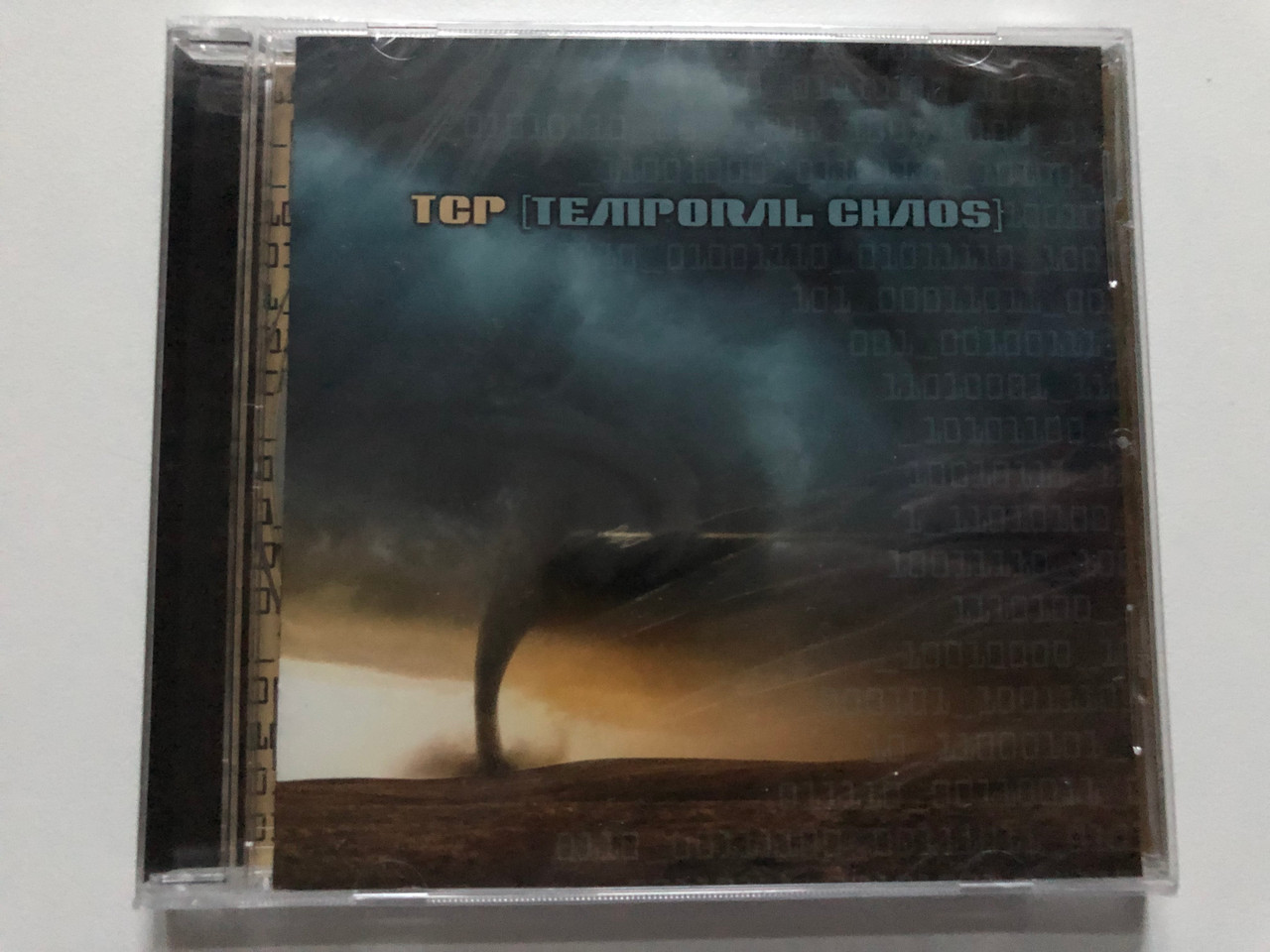 https://cdn10.bigcommerce.com/s-62bdpkt7pb/products/0/images/272393/TCP_Temporal_Chaos_Watt_Records_Audio_CD_2016_WATT003_1__21758.1681236659.1280.1280.JPG?c=2&_gl=1*1mraqlm*_ga*MjA2NTIxMjE2MC4xNTkwNTEyNTMy*_ga_WS2VZYPC6G*MTY4MTIzMTIyMC44NDQuMS4xNjgxMjM2NTczLjQ5LjAuMA..