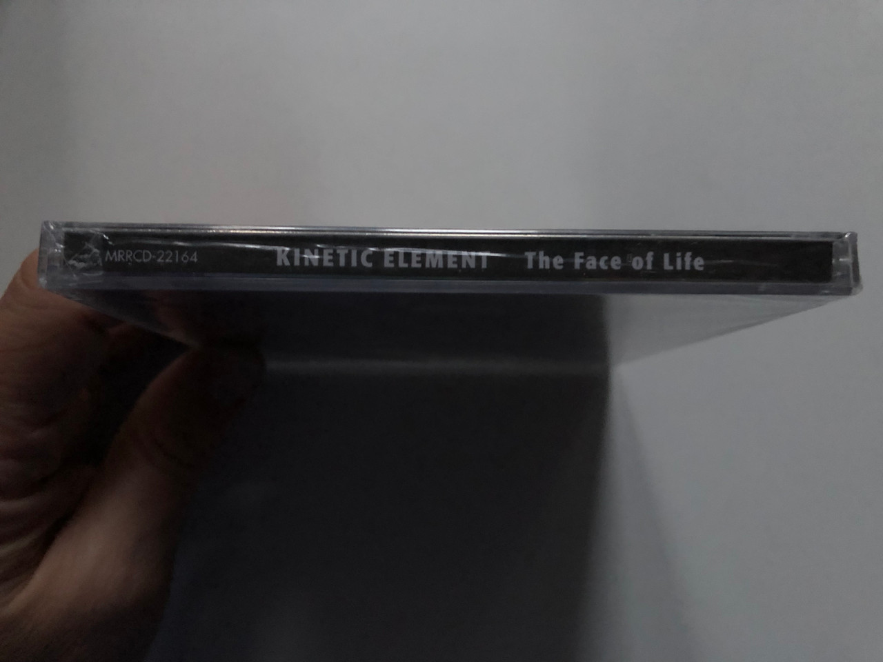 https://cdn10.bigcommerce.com/s-62bdpkt7pb/products/0/images/272395/Kinetic_Element_The_Face_Of_Life_Melodic_Revolution_Records_Audio_CD_2018_MRRCD-22164_3__10737.1681236897.1280.1280.JPG?c=2&_gl=1*1kdpp77*_ga*MjA2NTIxMjE2MC4xNTkwNTEyNTMy*_ga_WS2VZYPC6G*MTY4MTIzMTIyMC44NDQuMS4xNjgxMjM2OTI3LjYwLjAuMA..