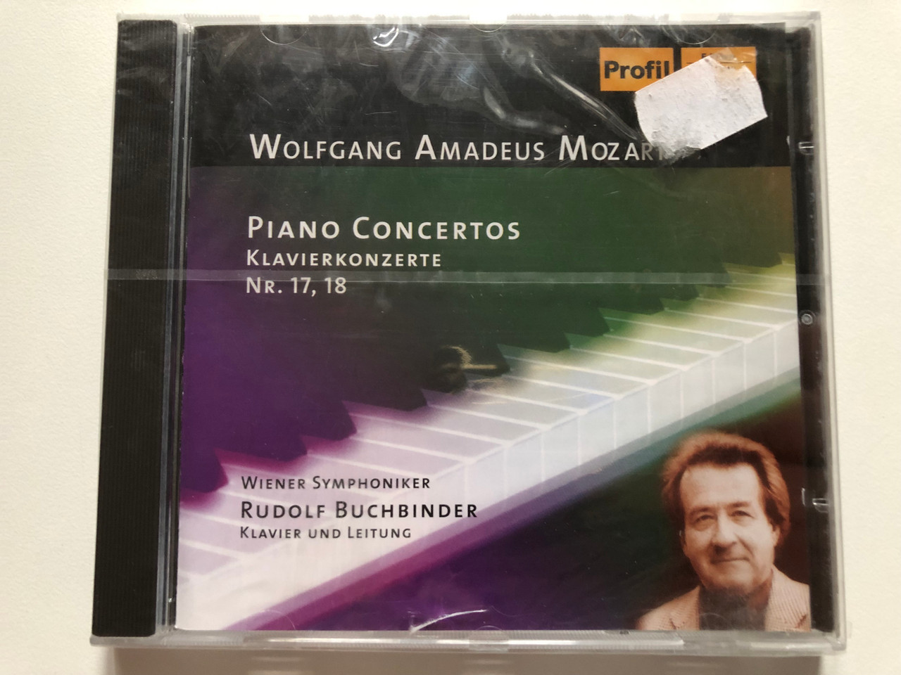 https://cdn10.bigcommerce.com/s-62bdpkt7pb/products/0/images/272589/Wolfgang_Amadeus_Mozart_Piano_Concertos_Nr._17_18_-_Wiener_Symphoniker_Rudolf_Buchbinder_klavier_und_leitung_Profil_Edition_Gnter_Hnssler_Audio_CD_2004_CD_PH_04006_1__34842.1681398435.1280.1280.JPG?c=2&_gl=1*3otw5k*_ga*MjA2NTIxMjE2MC4xNTkwNTEyNTMy*_ga_WS2VZYPC6G*MTY4MTM5NjQ3OC44NDYuMS4xNjgxMzk4NDAxLjM5LjAuMA..