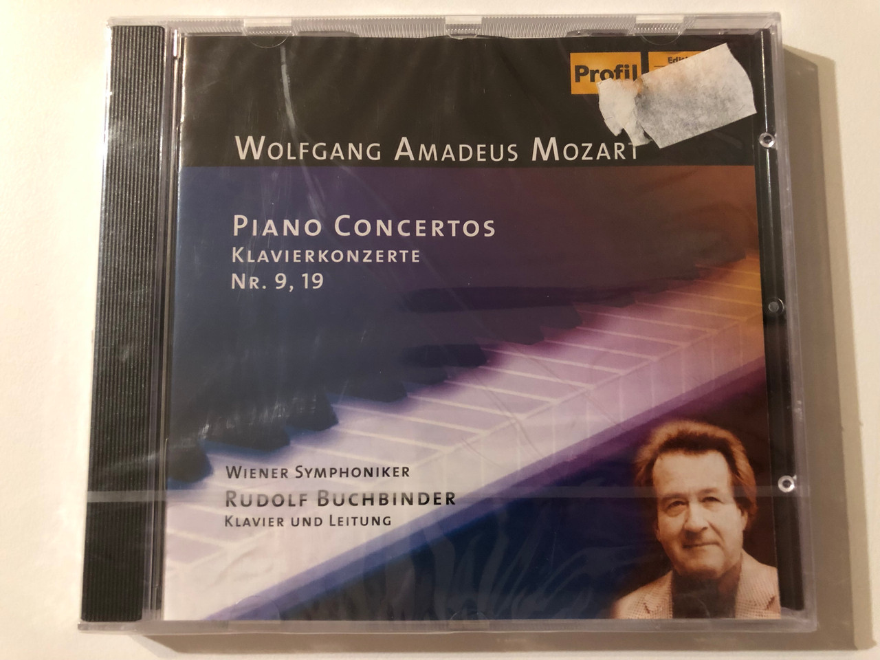 https://cdn10.bigcommerce.com/s-62bdpkt7pb/products/0/images/272858/Wolfgang_Amadeus_Mozart_Piano_Concertos_Klavierkonzerte_Nr._9_19_-_Wiener_Symphoniker_Rudolf_Buchbinder_klavier_und_leitung_Profil_Audio_CD_2004_CD_PH_04003_1__84496.1681720222.1280.1280.JPG?c=2&_gl=1*1n3ajar*_ga*MjA2NTIxMjE2MC4xNTkwNTEyNTMy*_ga_WS2VZYPC6G*MTY4MTcxODE4MS44NTAuMS4xNjgxNzE5OTc5LjMxLjAuMA..