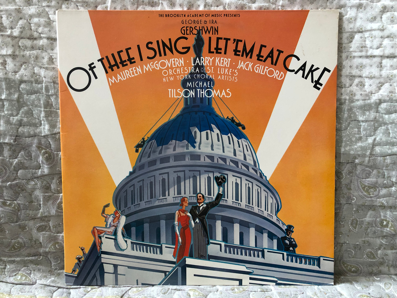 https://cdn10.bigcommerce.com/s-62bdpkt7pb/products/0/images/273747/George_Ira_Gershwin_-_Of_Thee_I_Sing_Let_Em_Eat_Cake_-_Maureen_McGovern_Larry_Kert_Jack_Gilford_Michael_Tilson_Thomas_Orchestra_Of_St._Lukes_New_York_Choral_Artists_FM_2x_LP_1987_F2M_42522_1__27053.1683124751.1280.1280.JPG?c=2&_gl=1*51l3m2*_ga*MjA2NTIxMjE2MC4xNTkwNTEyNTMy*_ga_WS2VZYPC6G*MTY4MzEyMjc5NC44NzYuMS4xNjgzMTI0MDM5LjU4LjAuMA..