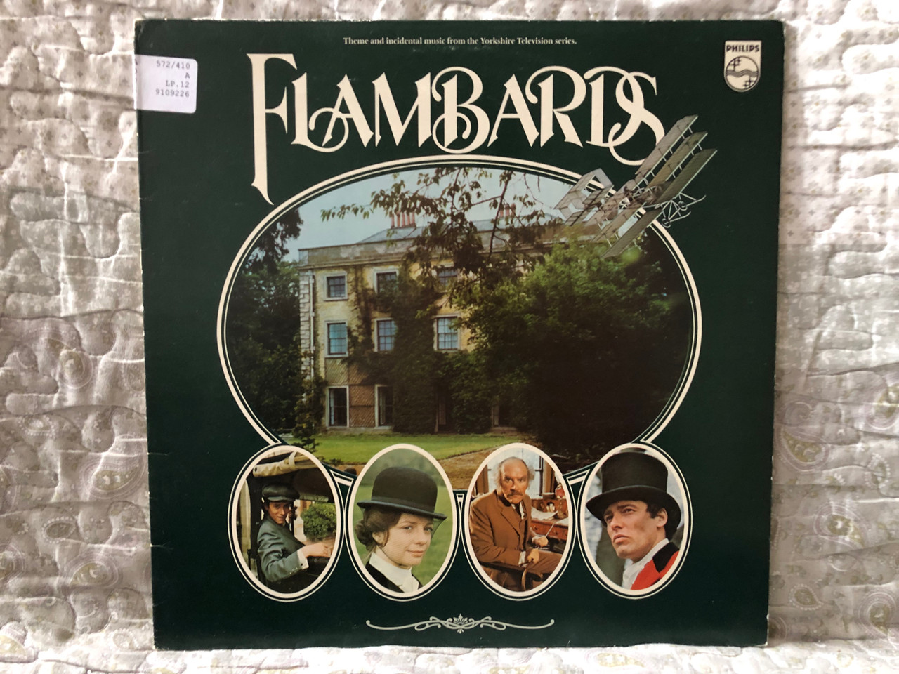 https://cdn10.bigcommerce.com/s-62bdpkt7pb/products/0/images/274312/Flambards_-_Theme_and_incidental_music_from_the_Yorkshire_Television_series._Philips_LP_1979_9109_226_1__15544.1683557455.1280.1280.JPG?c=2&_gl=1*dy8puv*_ga*MjA2NTIxMjE2MC4xNTkwNTEyNTMy*_ga_WS2VZYPC6G*MTY4MzU1NDgzMS44ODMuMS4xNjgzNTU3MjcyLjQwLjAuMA..
